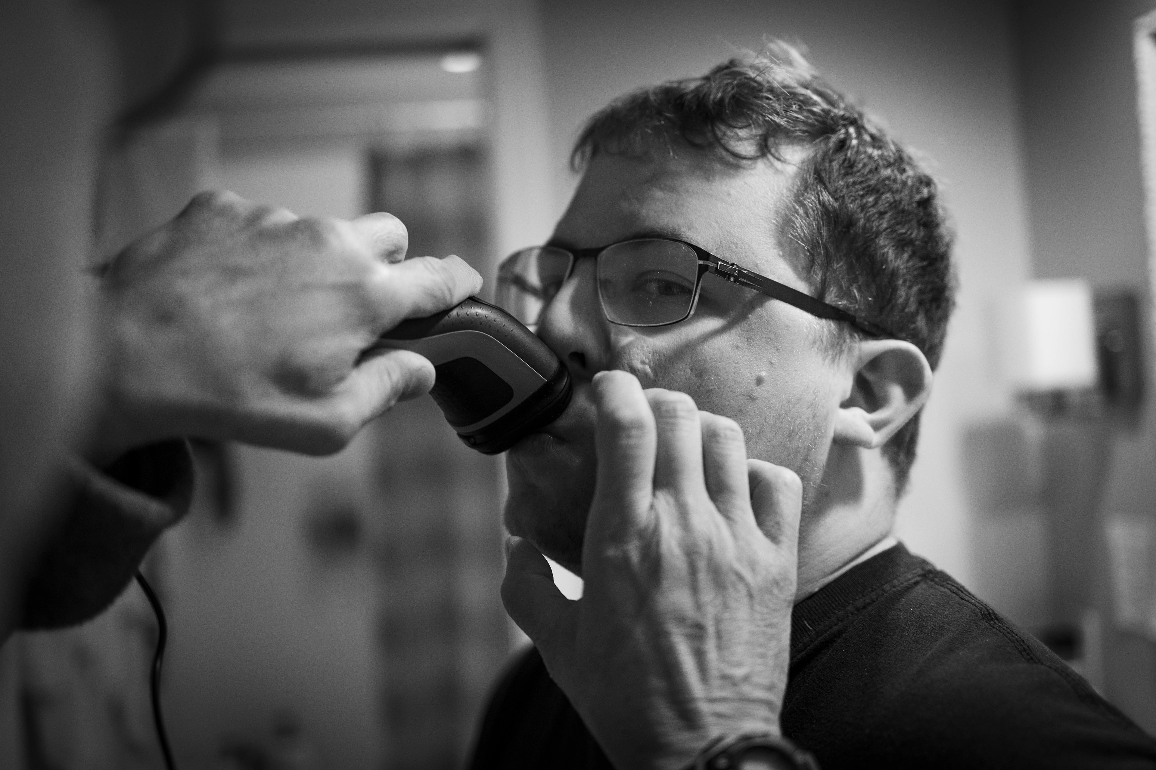 Evan receives help shaving from his father, Peter Koloski on Monday, November 17, 2025.