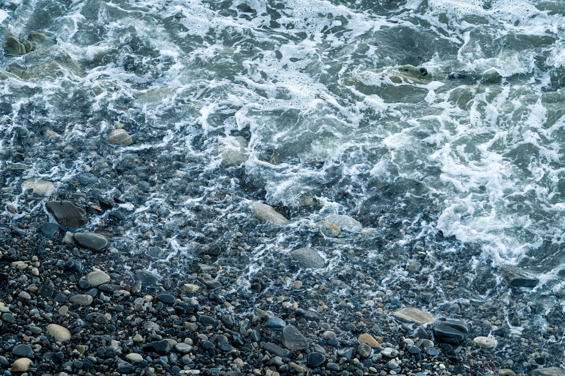 As every wave receeded the sound of the water draining through the rocky beach made a sound that reminded me of Rice Crispies. Snap, Crackle, Pop.