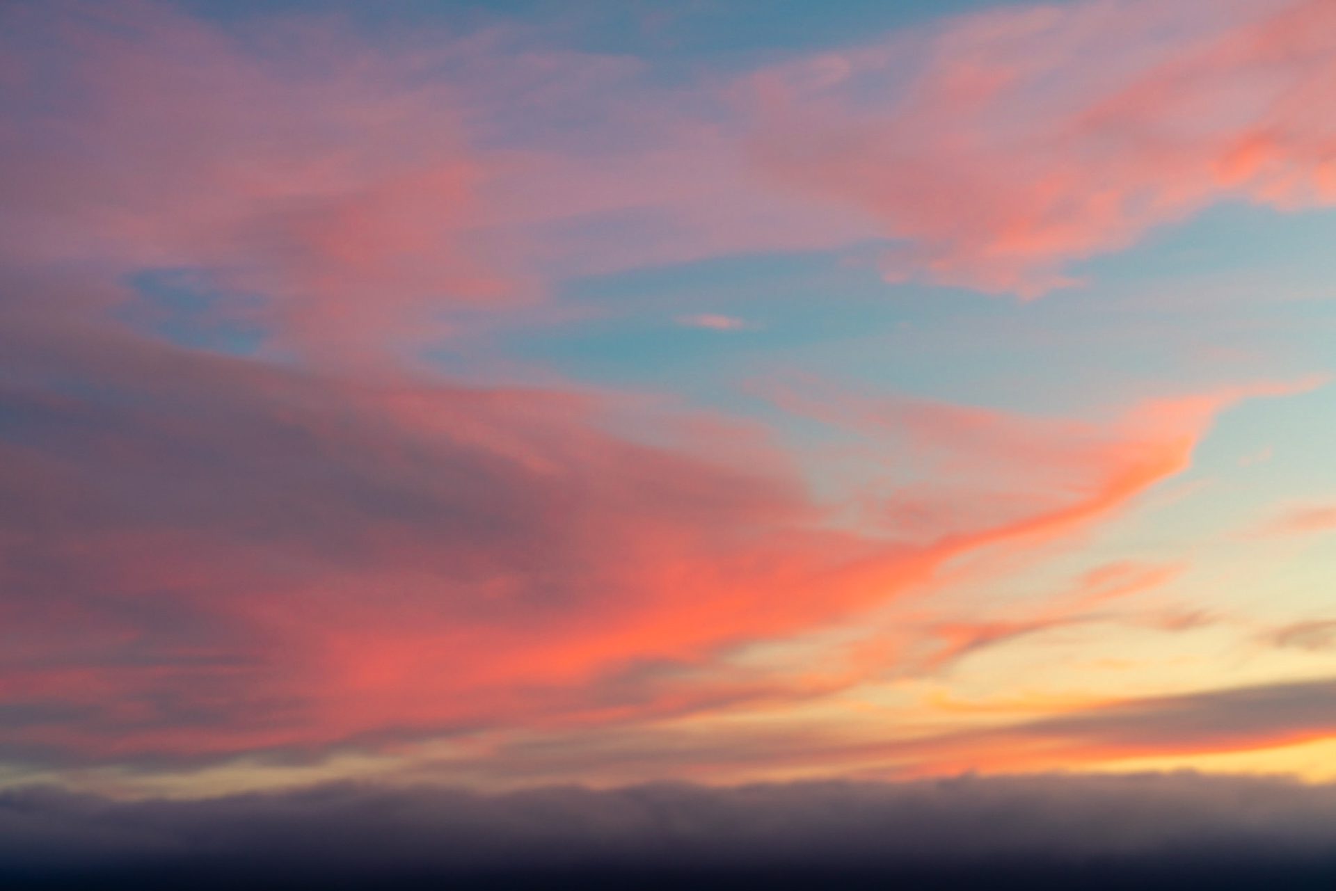 The sky was on fire for this sunset. I used a little bit of a slower shutter speed to give a slightly blurred dreamy feeling to the sweeping shape of the clouds.
