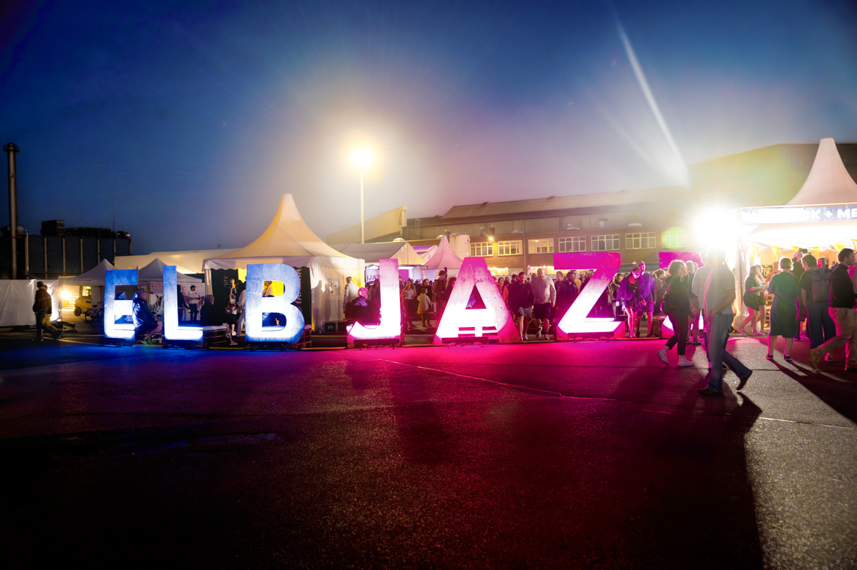 night shot of elbjazz letter in pink and blue