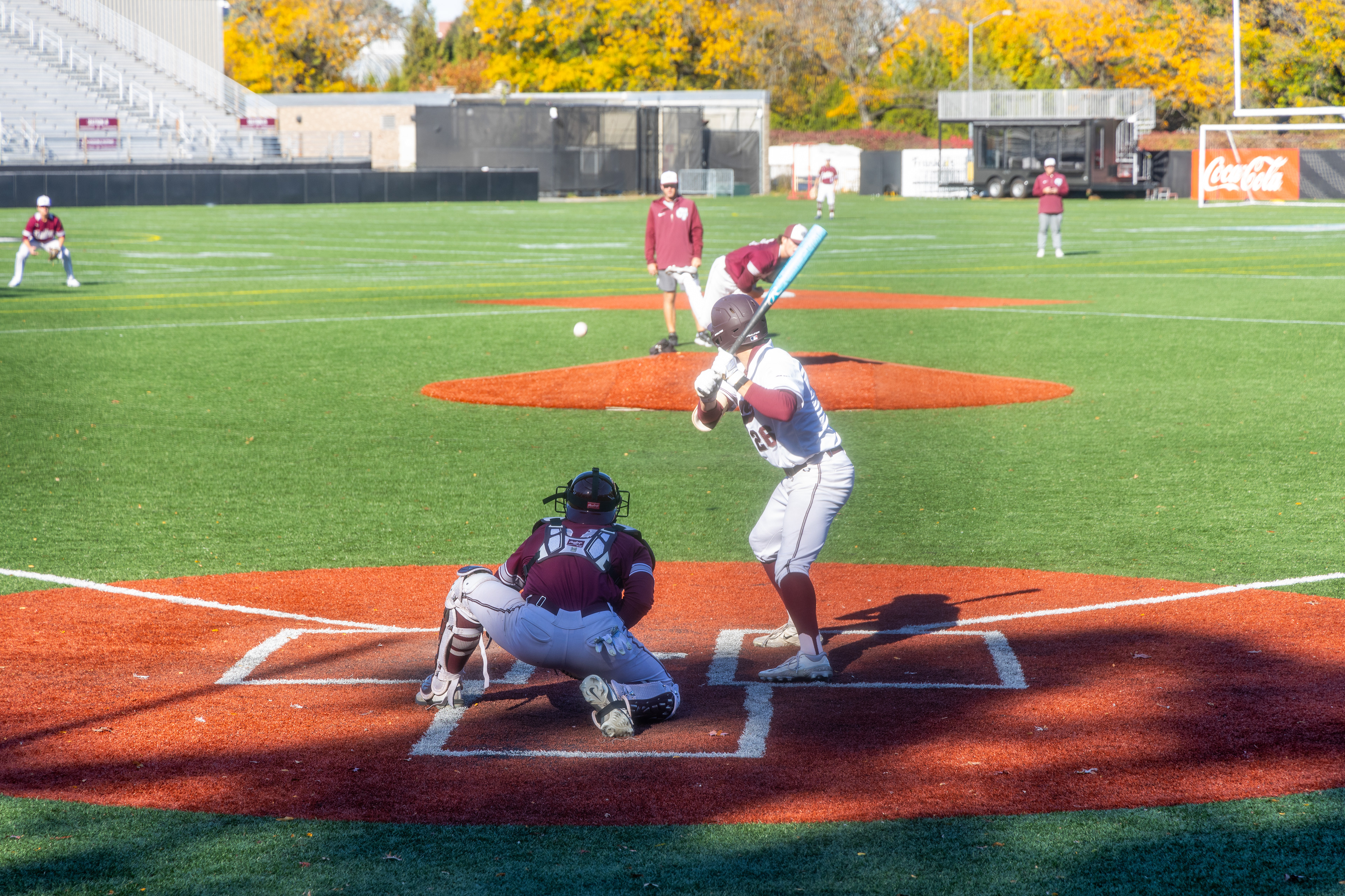 The batter prepares to strike the ball during a practice game.