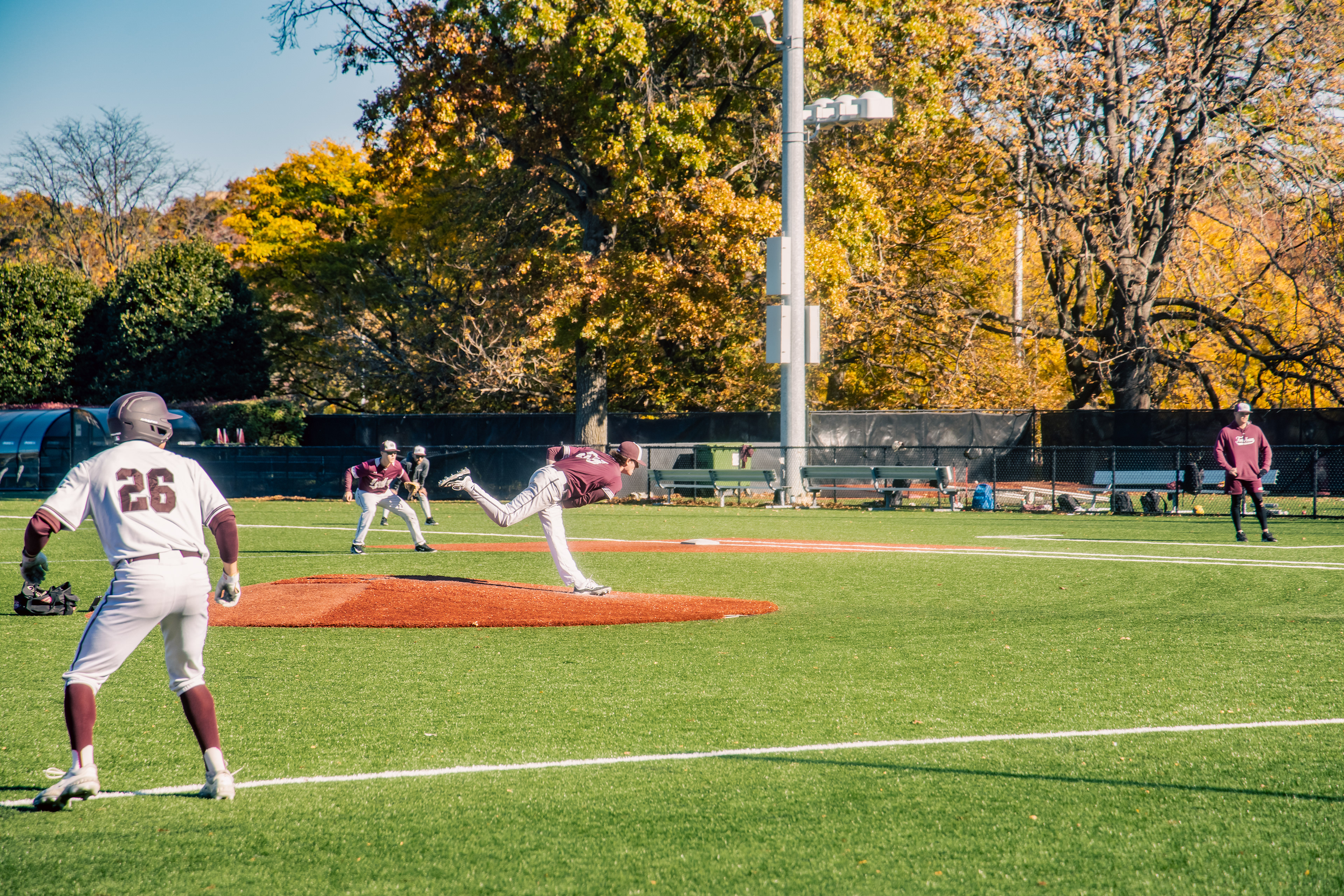 A pitcher, perfecting his form during a practice game.
