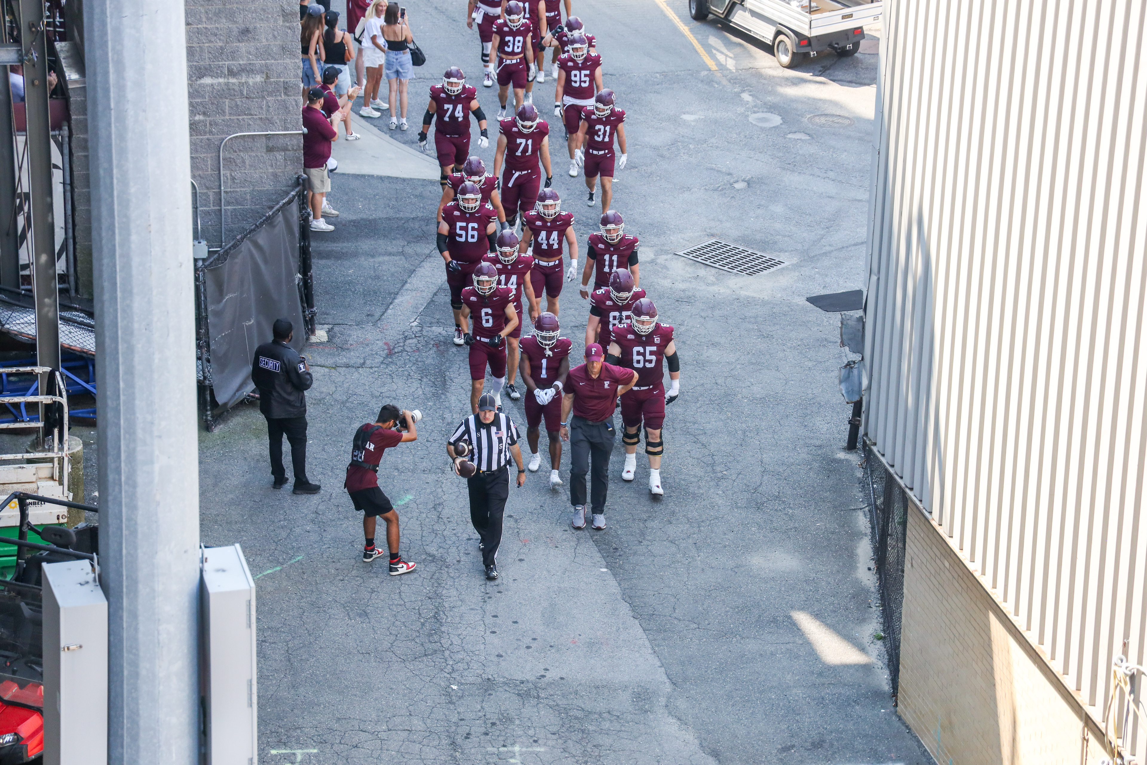 The team walking towards the field.