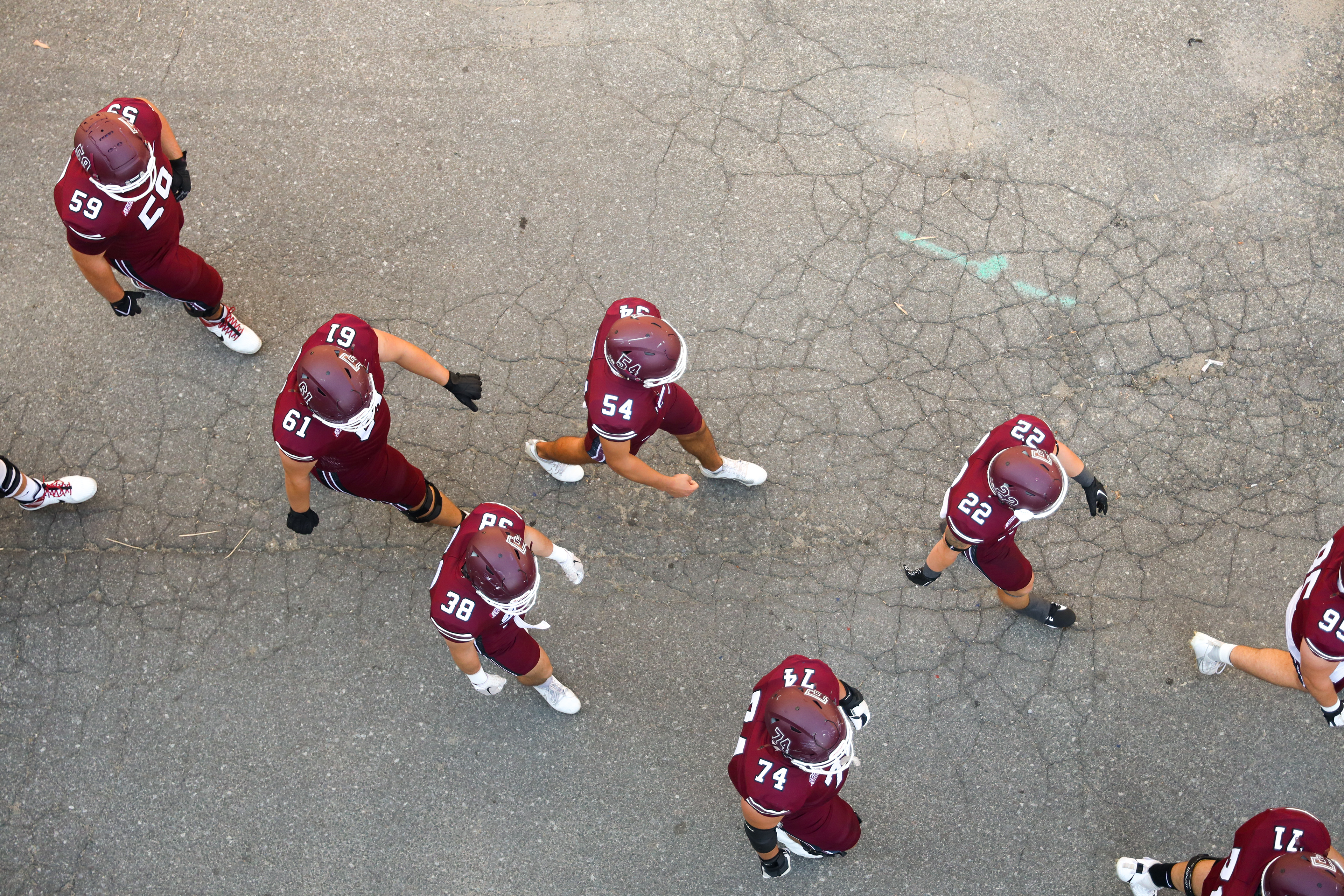 Top-down view of the team walking towards the field.