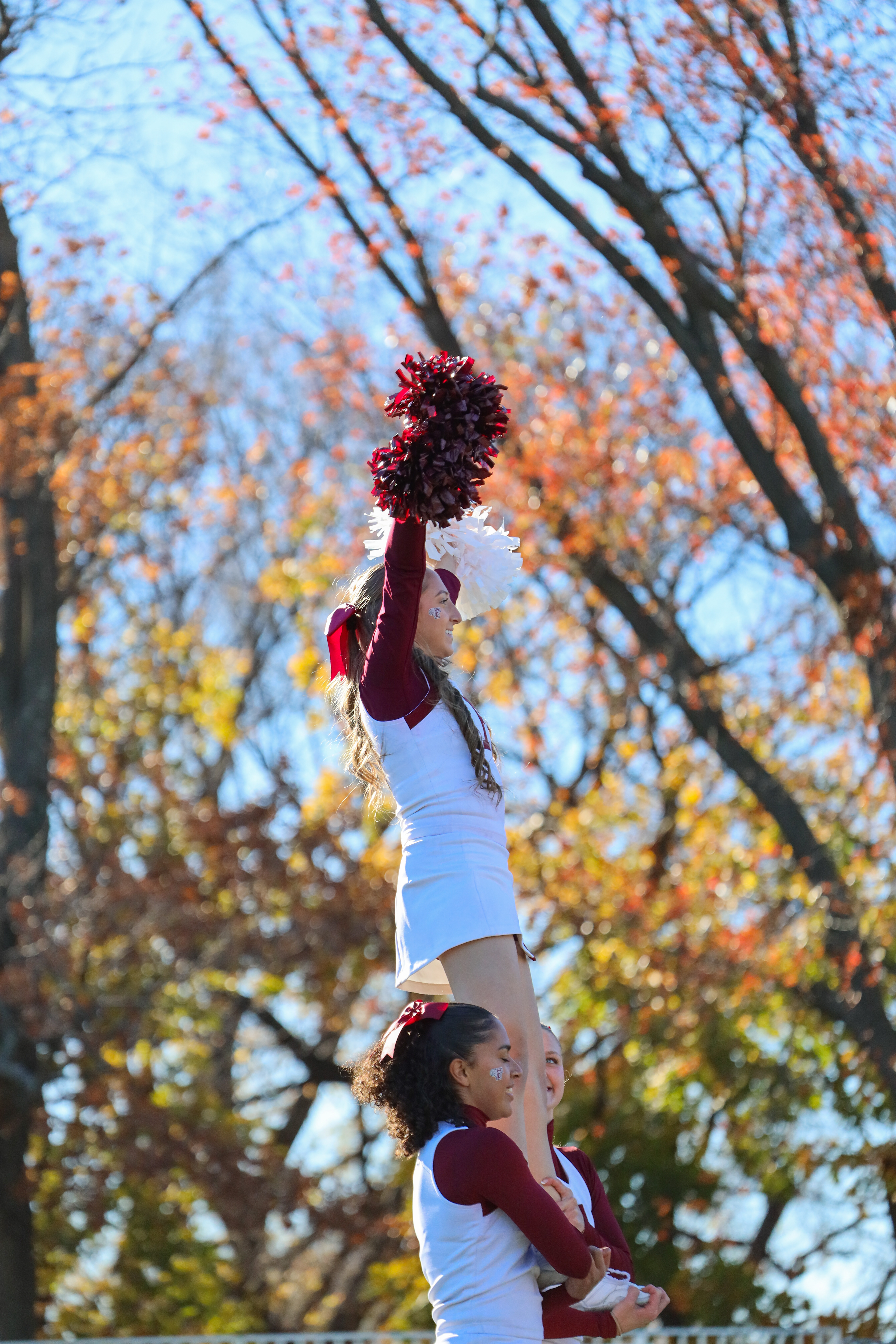 Cheer performing a stunt.