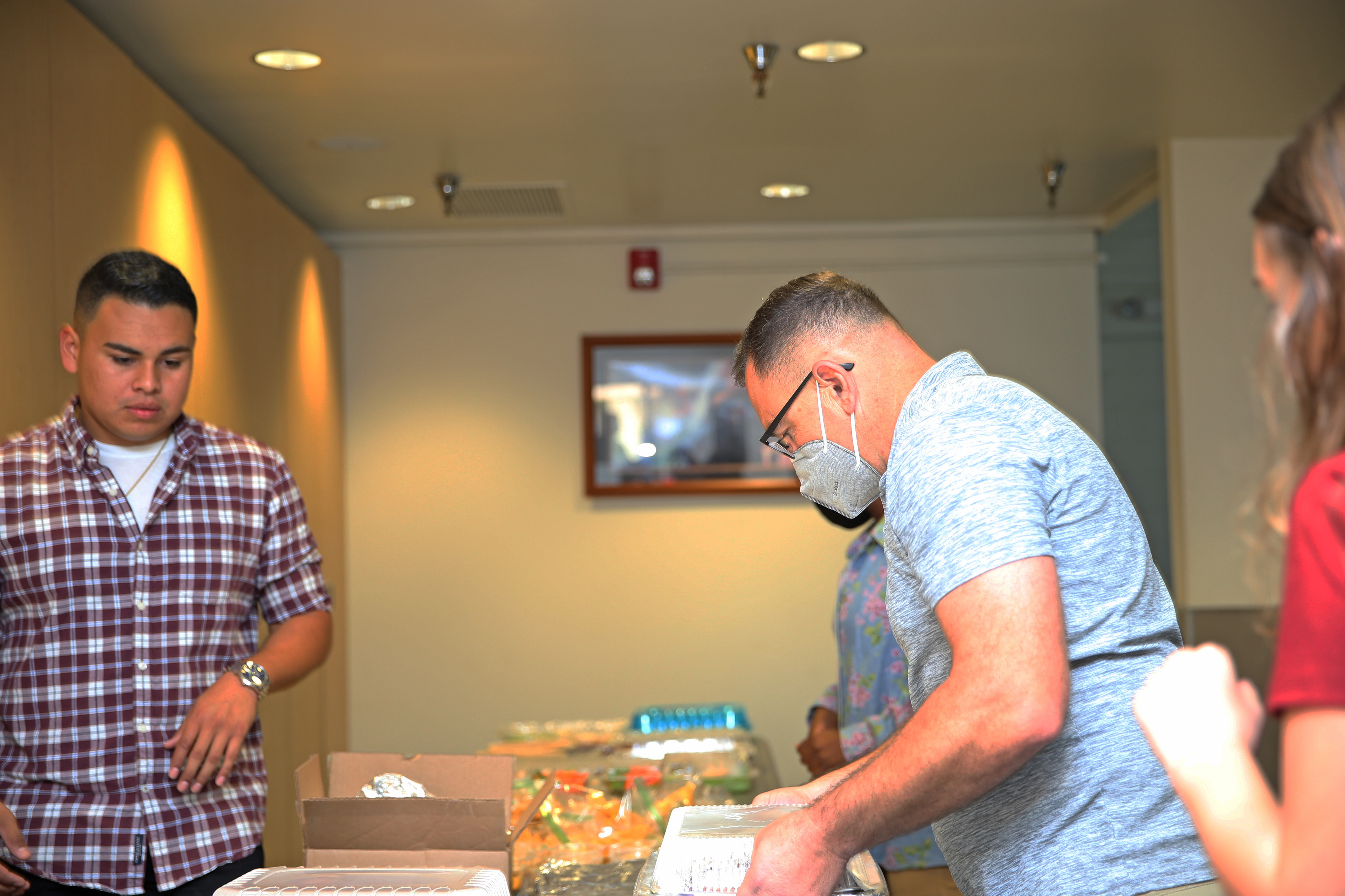 Col. Bango brings homemade food for the Single Marines.