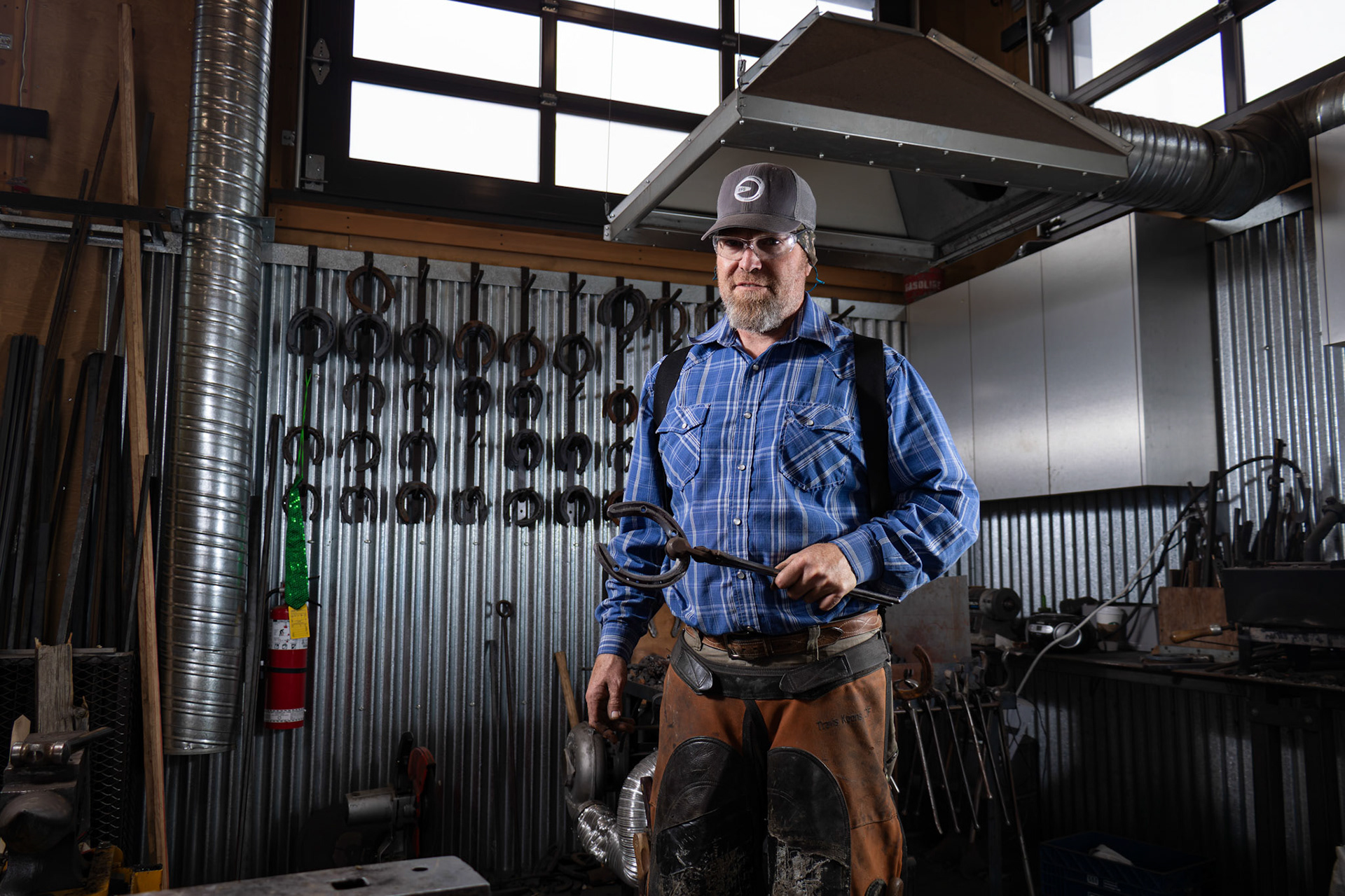Travis Koons, 47, poses for a portrait at a workshop at Spruce Meadows in SW Calgary on Tuesday, June 18, 2024. Originally from North Arizona, Travis has been shoeing horses for 31 years, starting at the age of 16. Spruce Meadows is famous for its premier equestrian events, including the 'National' tournament, which took place from June 12 to 16, 2024. (Photo by Armaan Khanna/SAIT)