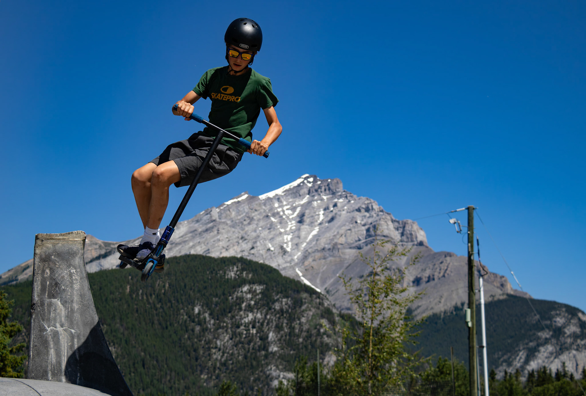 Anders Jhonathan Leif Karlos performs a trick against the stunning backdrop of the mountains during the BanffLIFE Skatepark Community BBQ in the town of Banff, Alberta, on Thursday, July 11, 2024. The event featured soda and hotdogs, bringing the community together for a day of fun and excitement. (ARMAAN KHANNA RMO PHOTO)