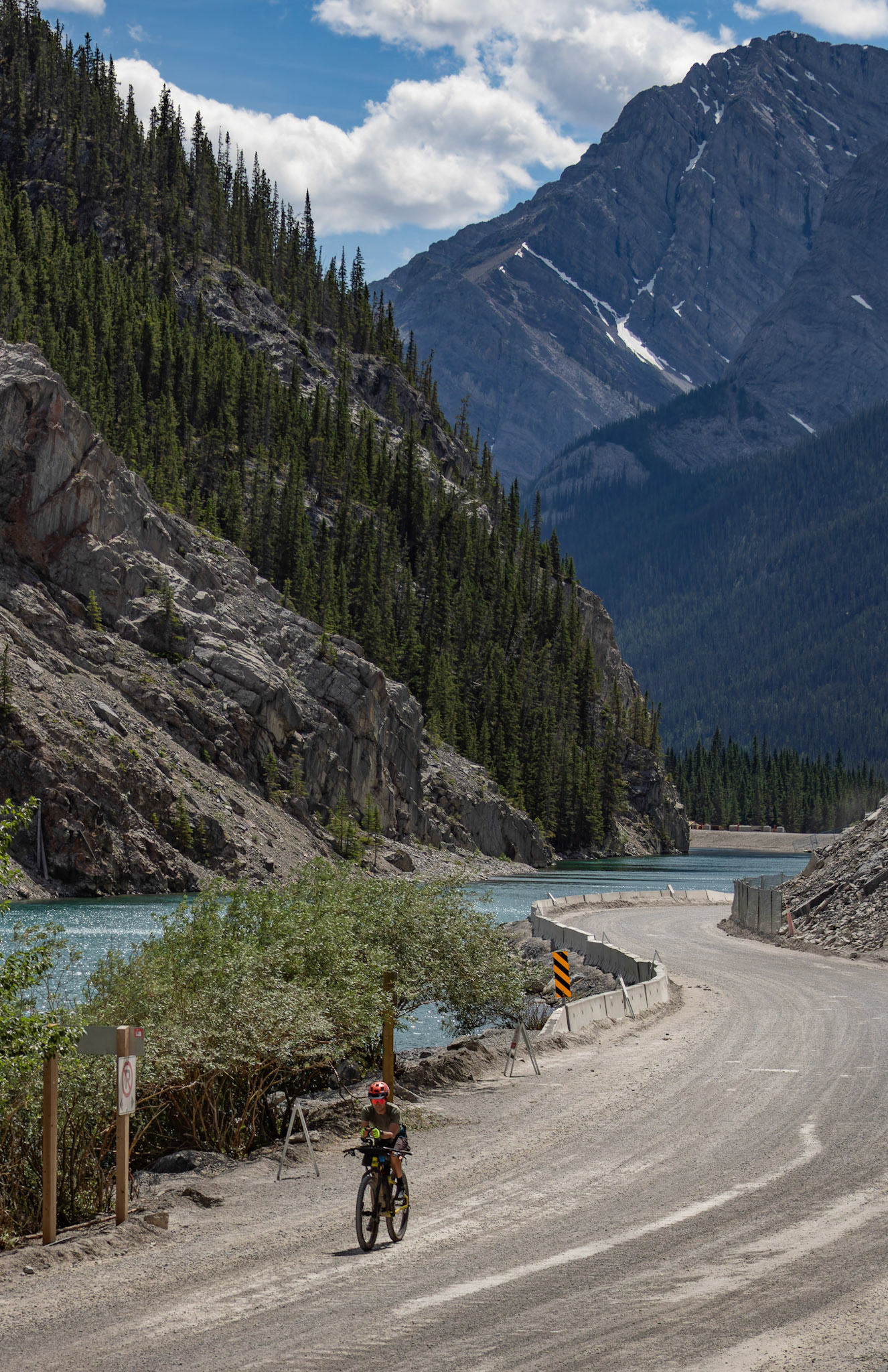 Cyclist on a dirt road with a scenic view of mountains at Whitemans Pond, Canmore on Saturday (July 13). ARMAAN KHANNA RMO PHOTO