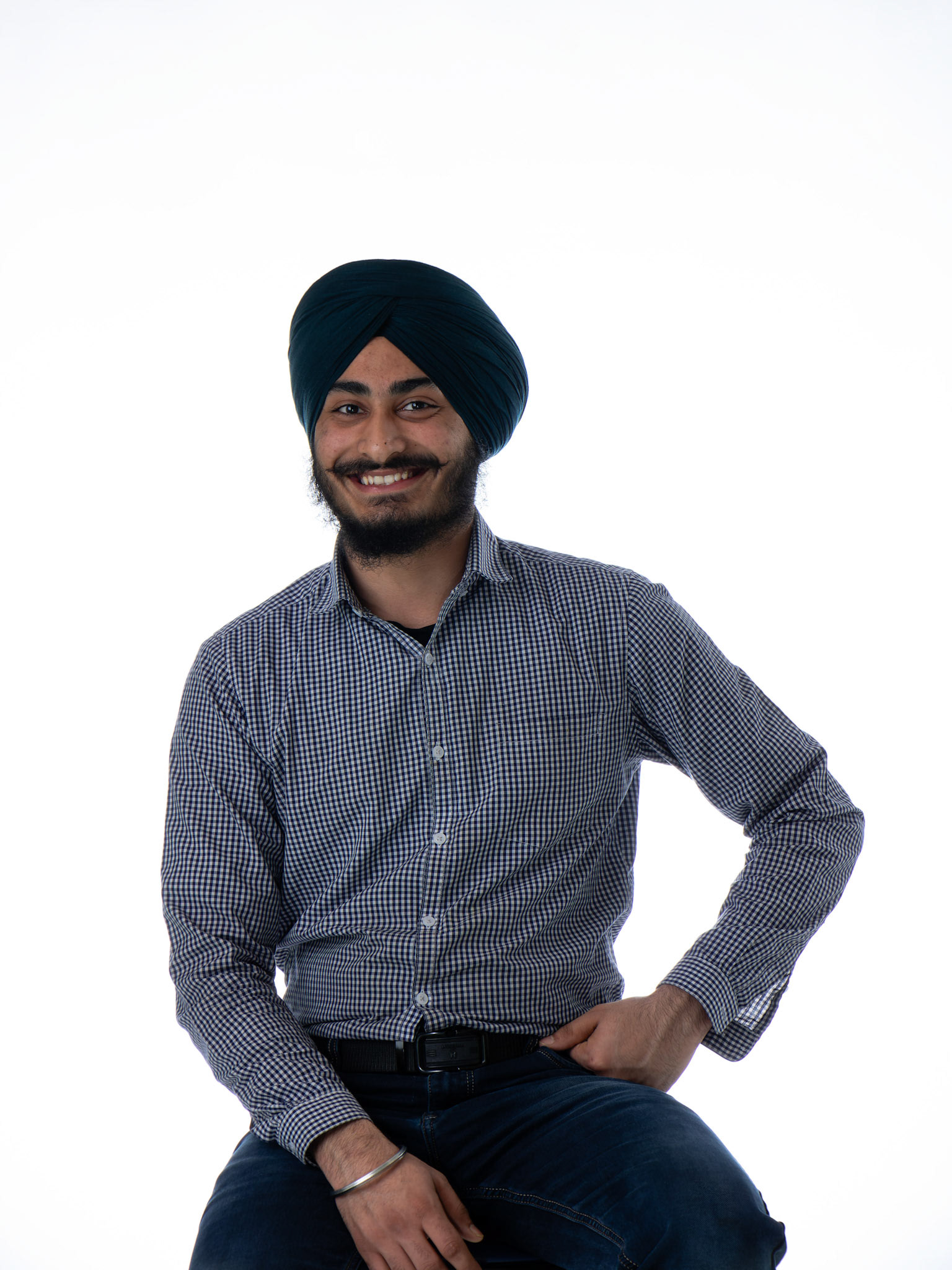 Harpreet Singh, a full-time ITS student at SAIT, poses for a portrait inside SAIT’s Senator BurnsBuilding in Calgary on Tuesday, April 2, 2024. Harpreet is originally from Hoshiarpur, Punjab, India and migrated to Canada in May 2023 after completing high school and a six-month Diploma in Computer Application. His hobbies include reading books and watching videos on YouTube. (Photo by Armaan Khanna/SAIT)