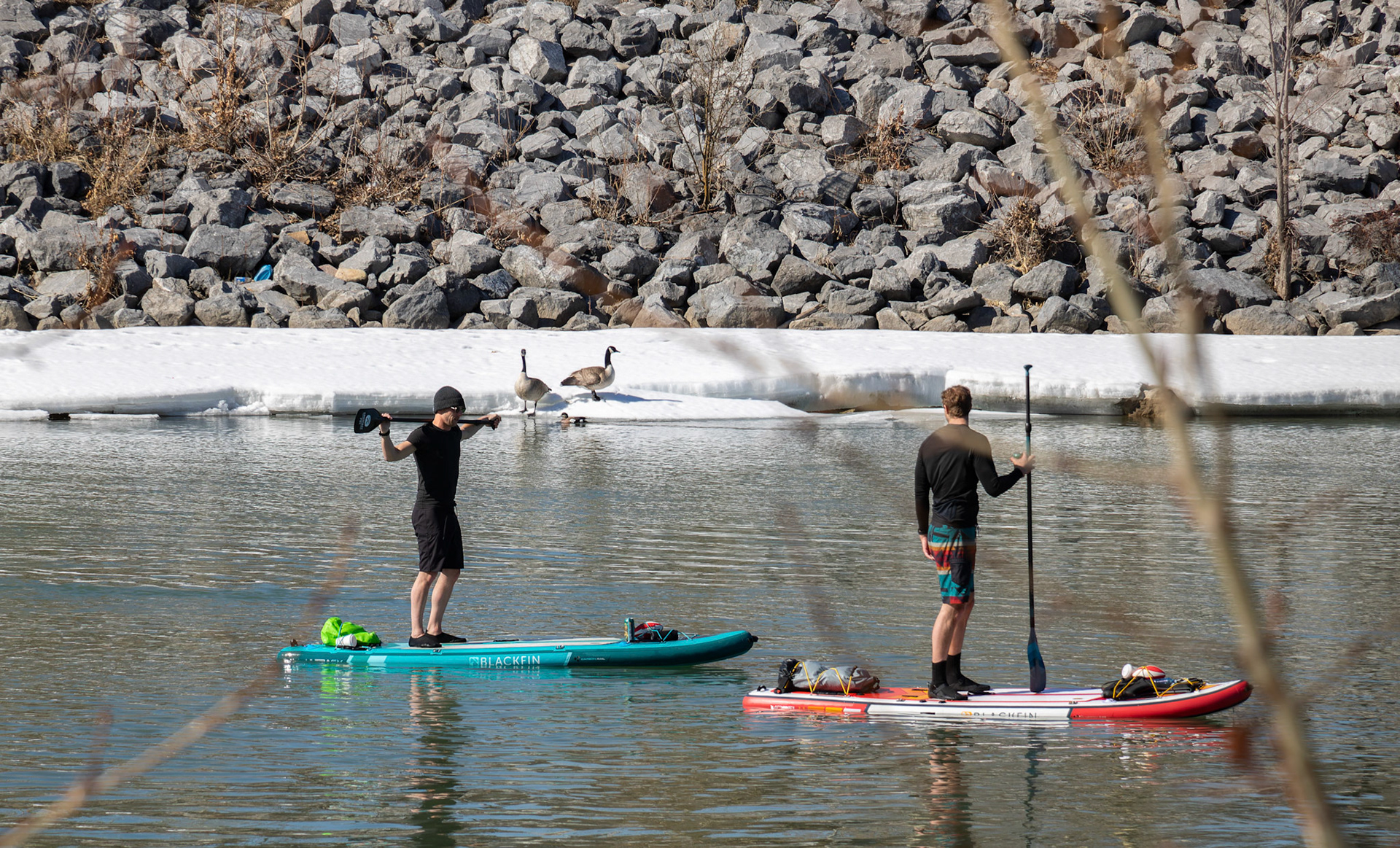 People take advantage of the warm spring weather by kayaking on the Bow River in Calgary on Monday, April 1, 2024. With the snow melting away and weather forecasts predicting warmer temperatures this week onwards, Calgarians can expect to see increased activity near the Bow River in the upcoming days, making it a popular destination for recreation. (Photo by Armaan Khanna/The Press)