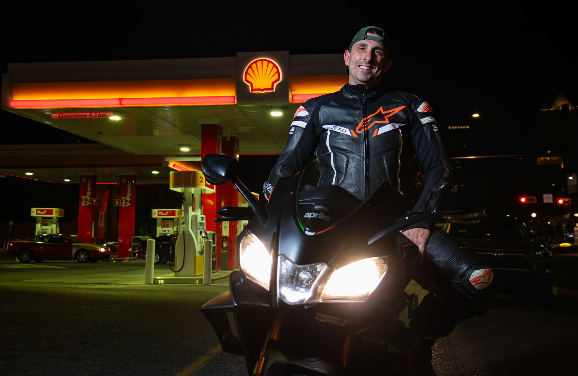 Ryan Dickson poses with his 2019 Aprilia RSV4 Factory Edition motorcycle in front of the Shell gas station on 17th Ave, downtown Calgary, on Saturday, June 29, 2024. Ryan, a passionate motorcyclist, enjoys the weekend scene where bikers frequently gather at this popular spot.(Photo by Armaan Khanna/SAIT)