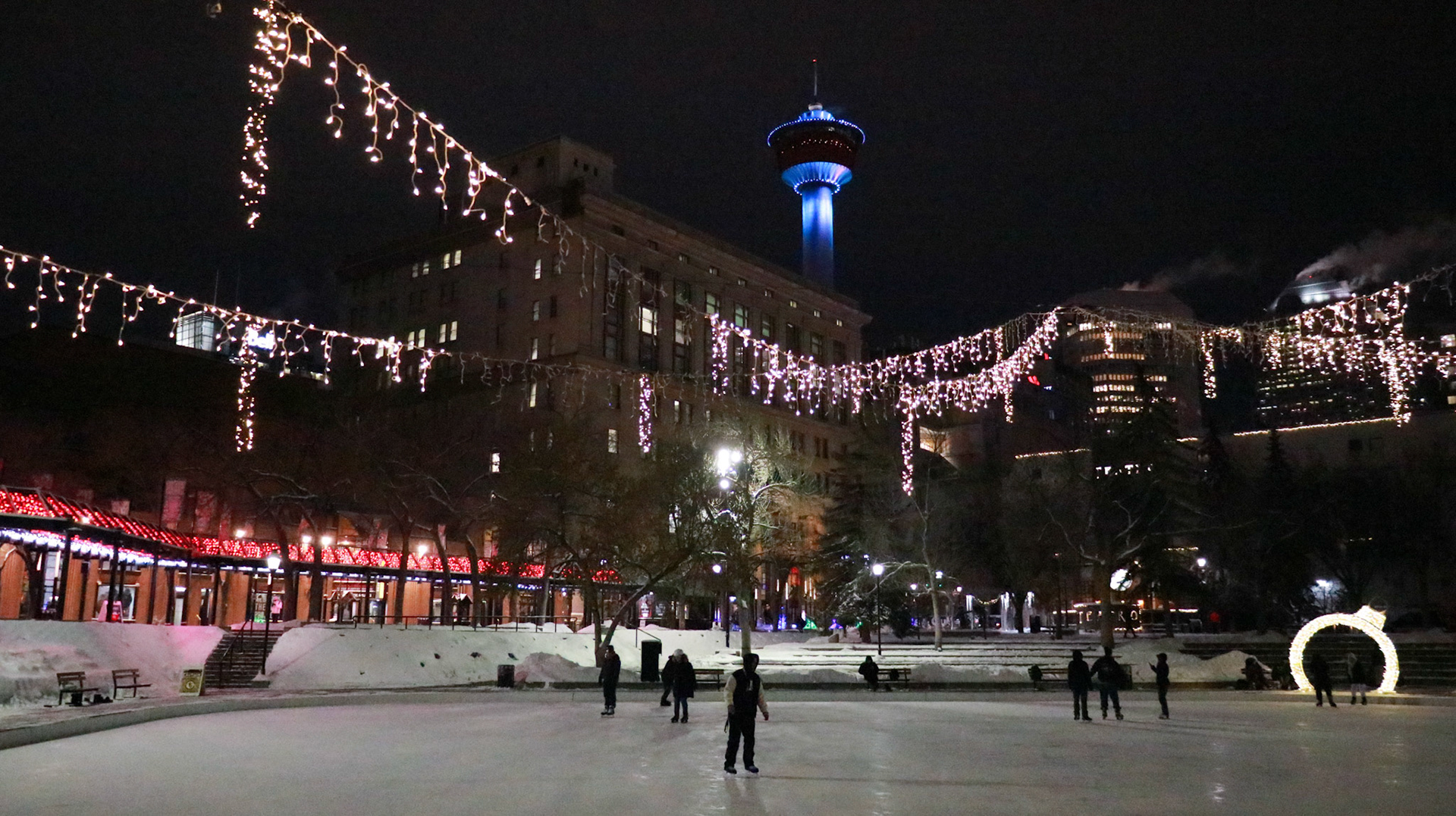 This photo displays recreational ice skating at Olympic Plaza in downtown Calgary, Alta. The photo was captured in the evening on Friday, Jan. 19, 2024, around 6:00 PM. -23°C isn’t too cold for these Calgarians to not go outside for ice skating. This shot captures a moment where people are seen enjoying the ice with the iconic Calgary Tower in the background adding to the scene.(Photo by Armaan Khanna/The Press)