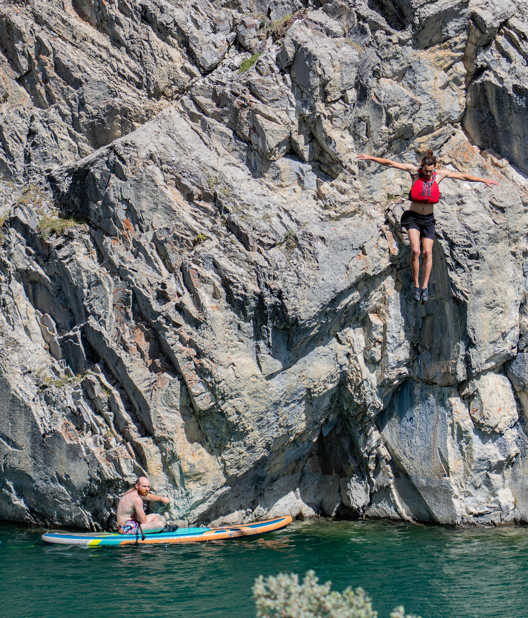 Nick Daley rafting and Keenan Gaugio jumping off a cliff in Whitemans Pond, Canmore on Saturday (July 13). ARMAAN KHANNA RMO PHOTO