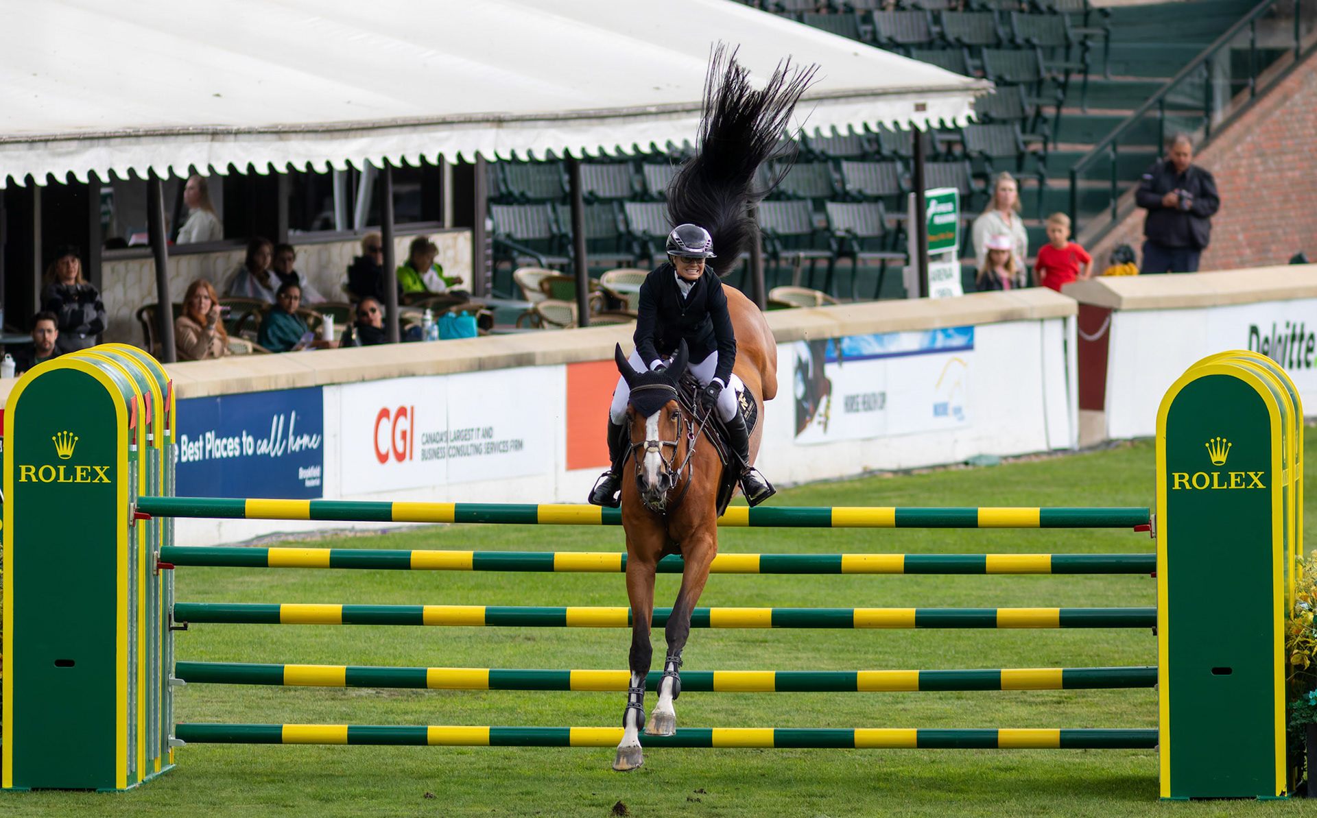 Erynn Ballard of Canada competes on Nikka VD Bisschop in the 445 – RBC Grand Prix of Canada, presented by Rolex – 1.60m event at the International Ring in Spruce Meadows, SW Calgary, on Saturday, June 15, 2024. Spruce Meadows is renowned for hosting top-tier equestrian competitions, such as the 'National' tournament, held from June 12 to 16, 2024. (Photo by Armaan Khanna/SAIT)