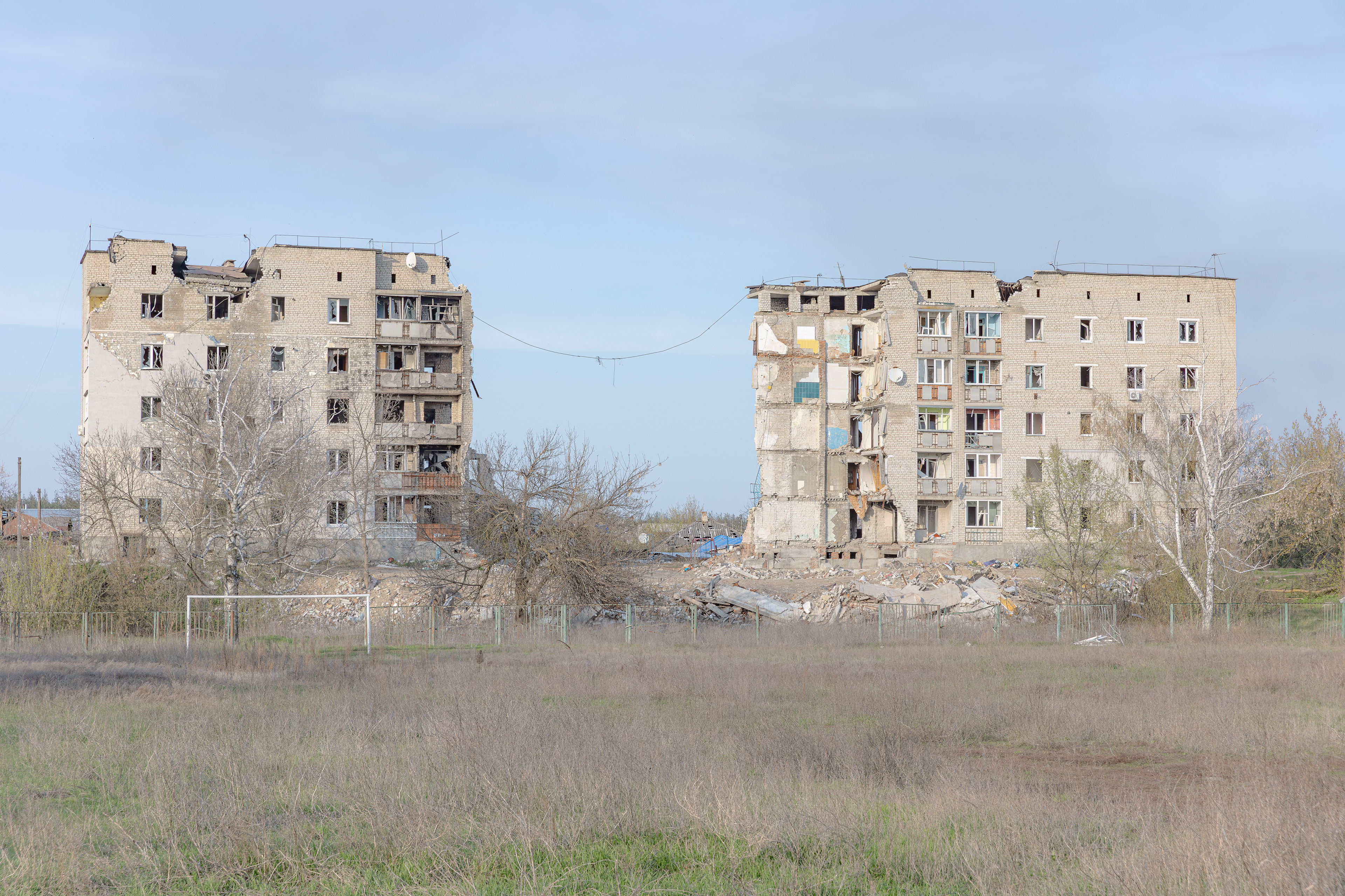 On March 9, 2022, a Russian FAB-500 bomb struck this residential building in Izium, Kharkiv Oblast, Ukraine, killing at least 44 people. Many residents sought safety in the central basement, away from drafty exits, believing they would find shelter and warmth.