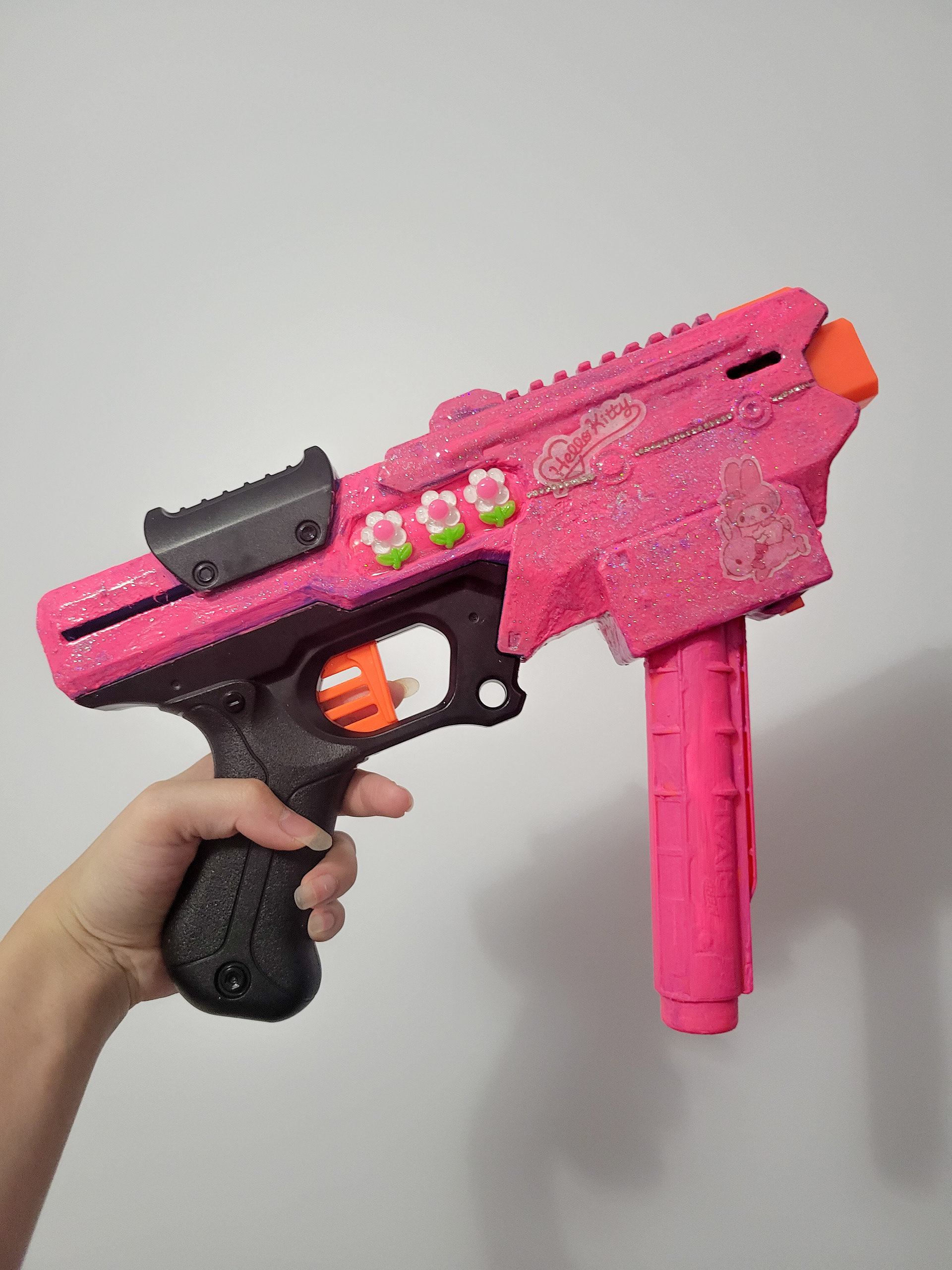 stinger | 12" x 9" | Mixed media on toy gun | 2023 | holding