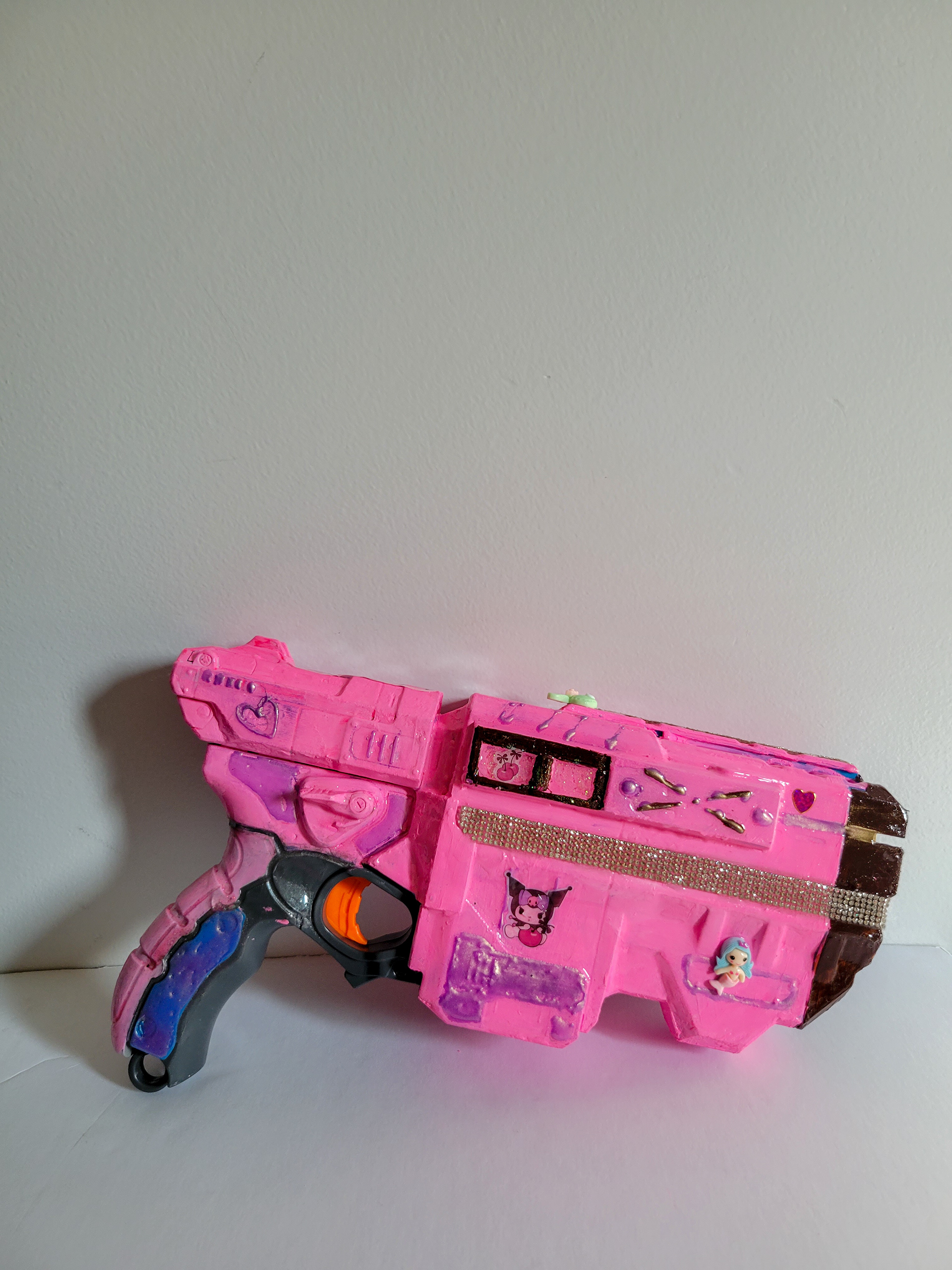 Sheriff Skin | 12" x 6" | Mixed media on toy gun | 2023 | side 1