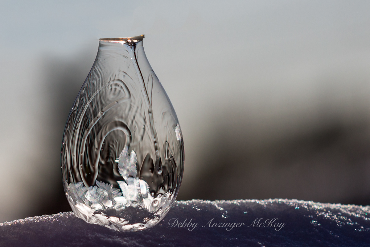 Blown frozen soap bubble
