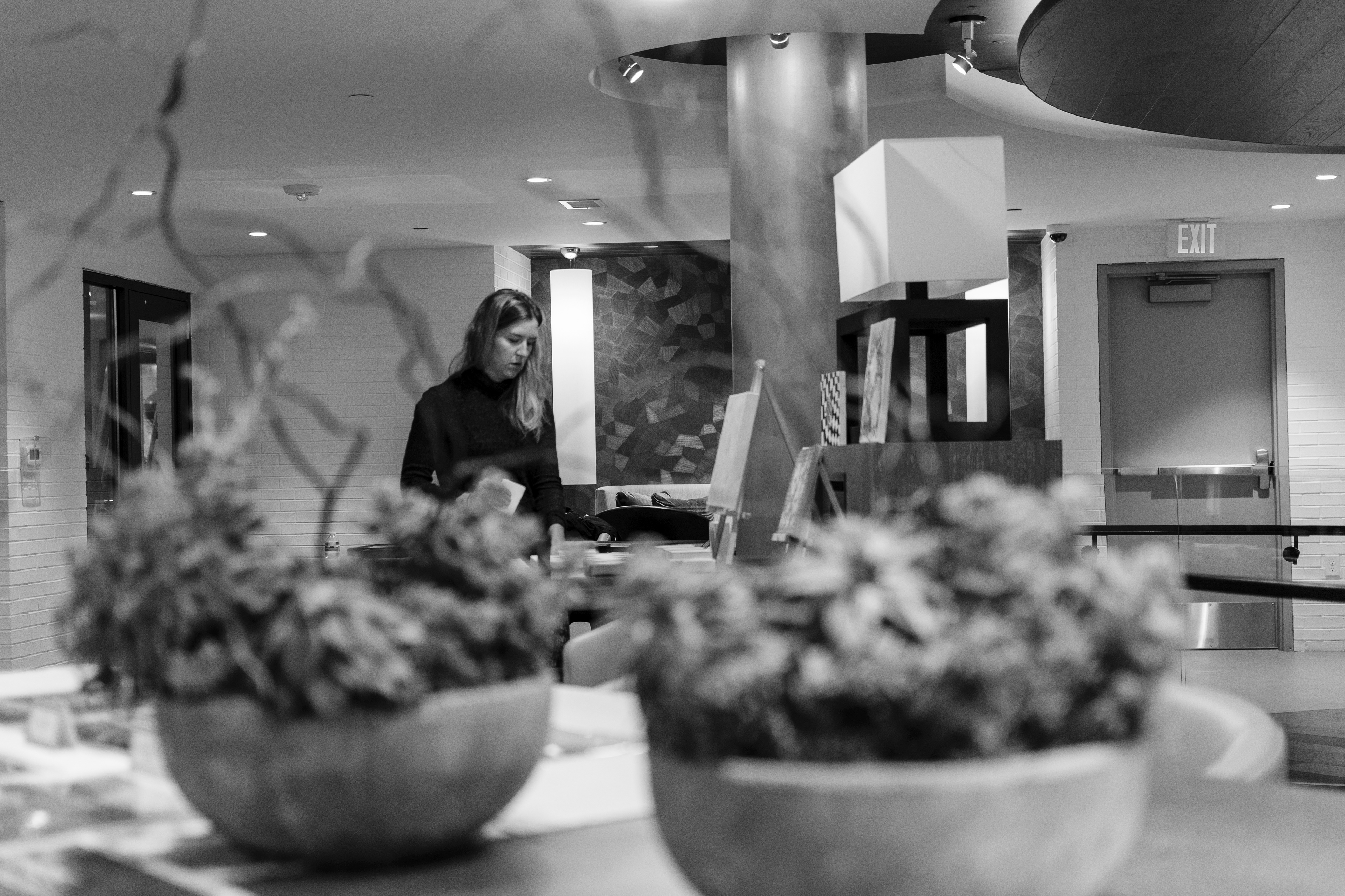 Kasey arranging her paintings