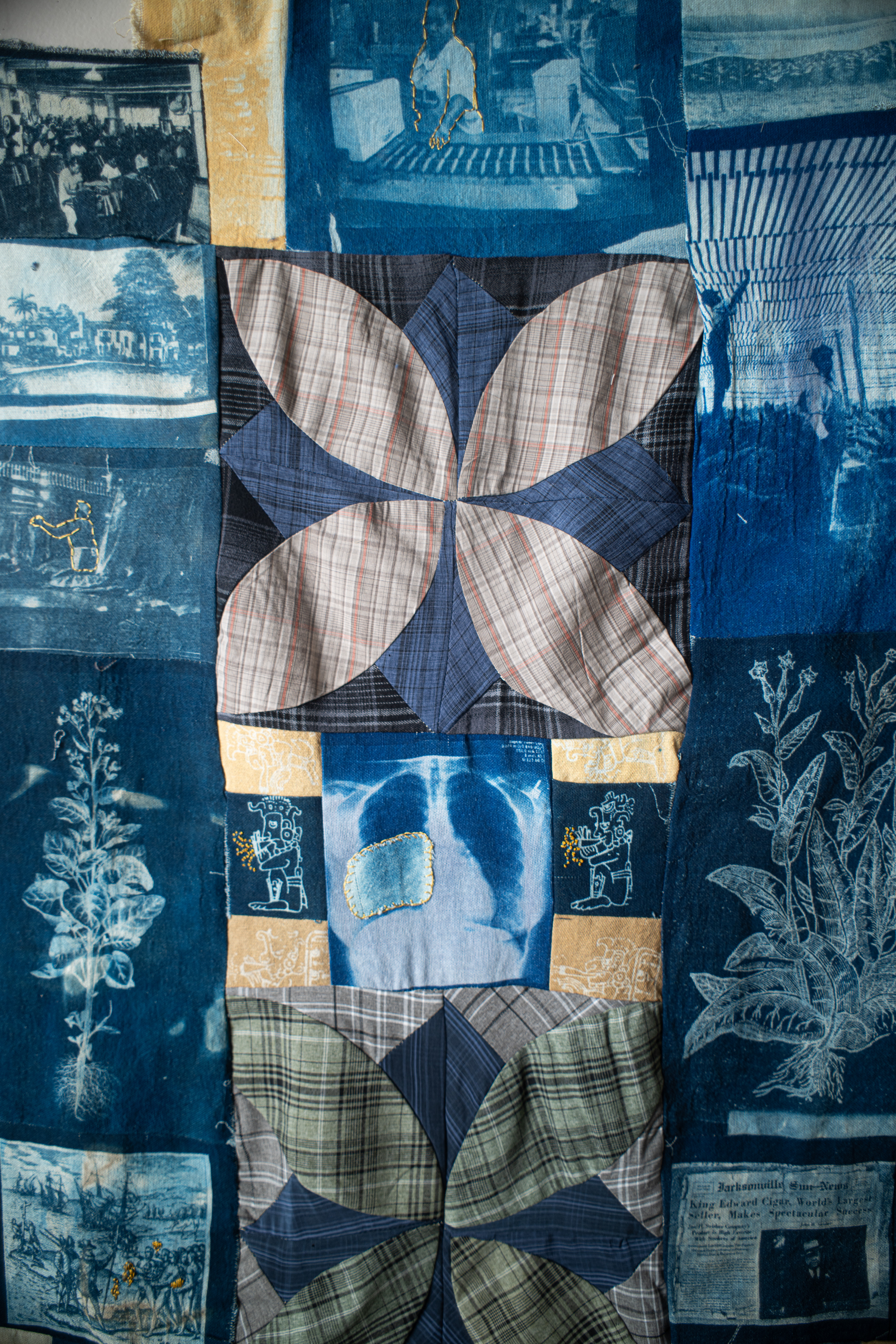 Quilt made of tobacco cloth and plaid shirts