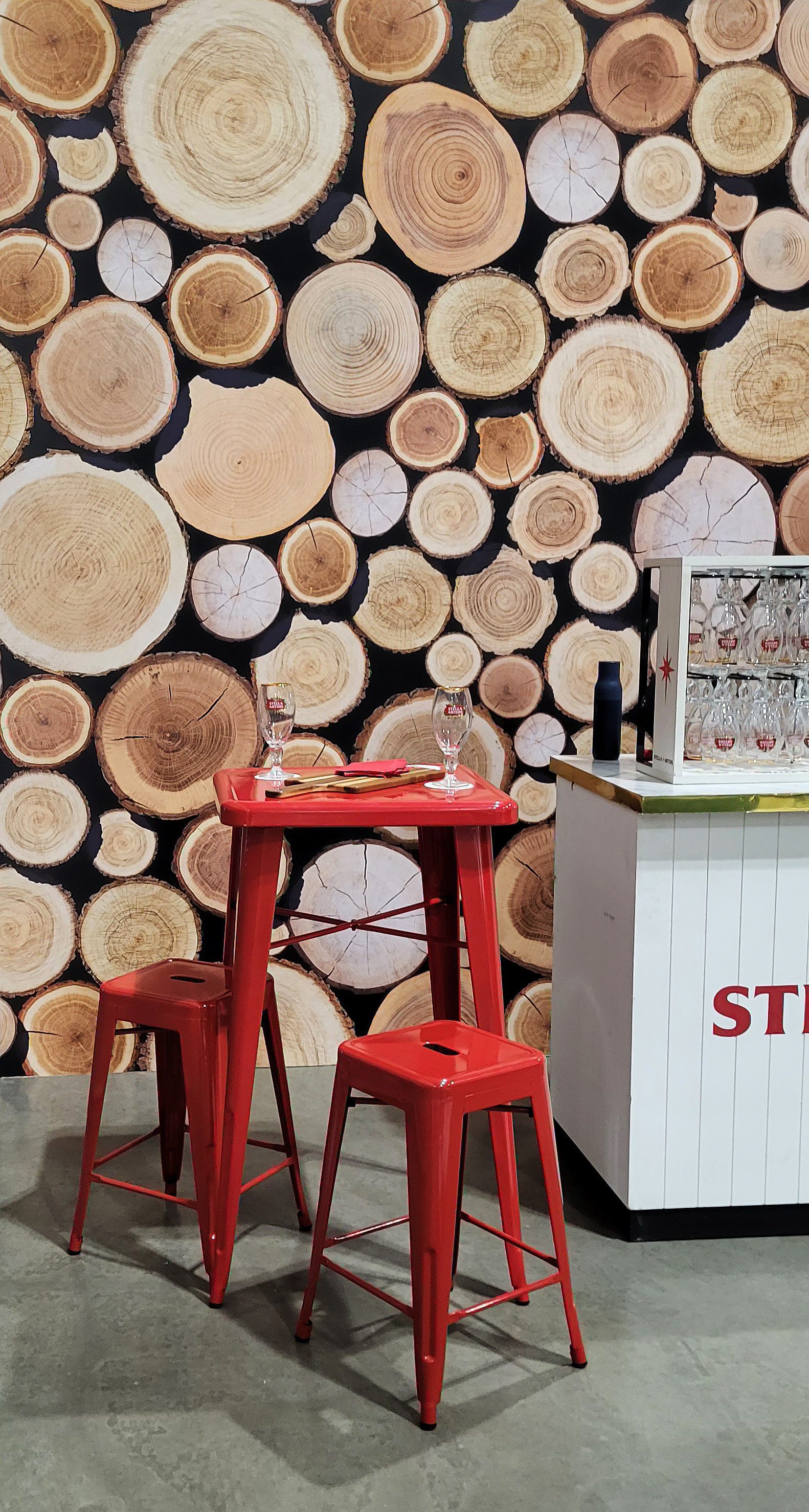 A large wall with a realistic stacked cut-log design.