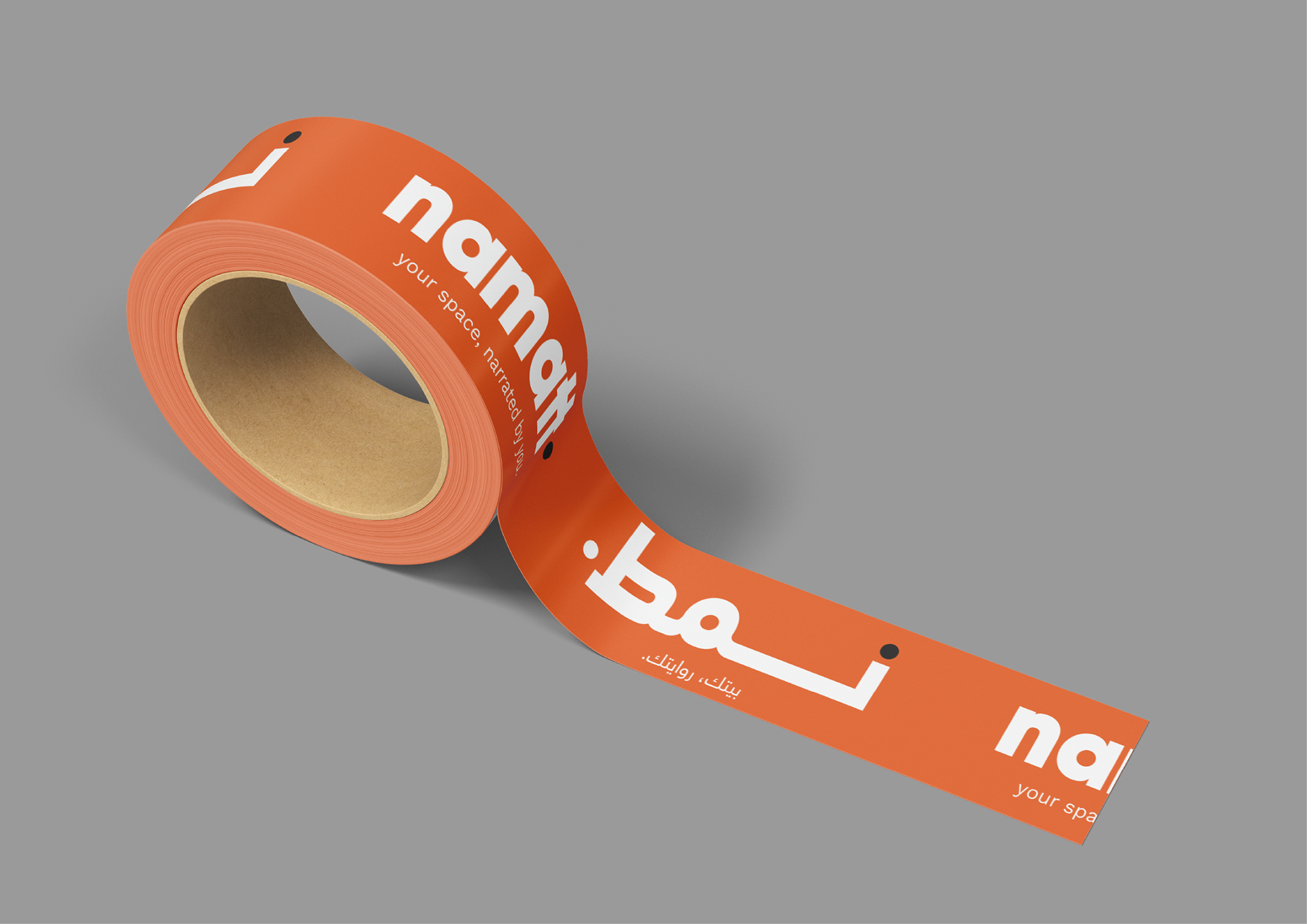 Orange NAMATT packaging tape mockup featuring repeating white Arabic and English wordmarks.