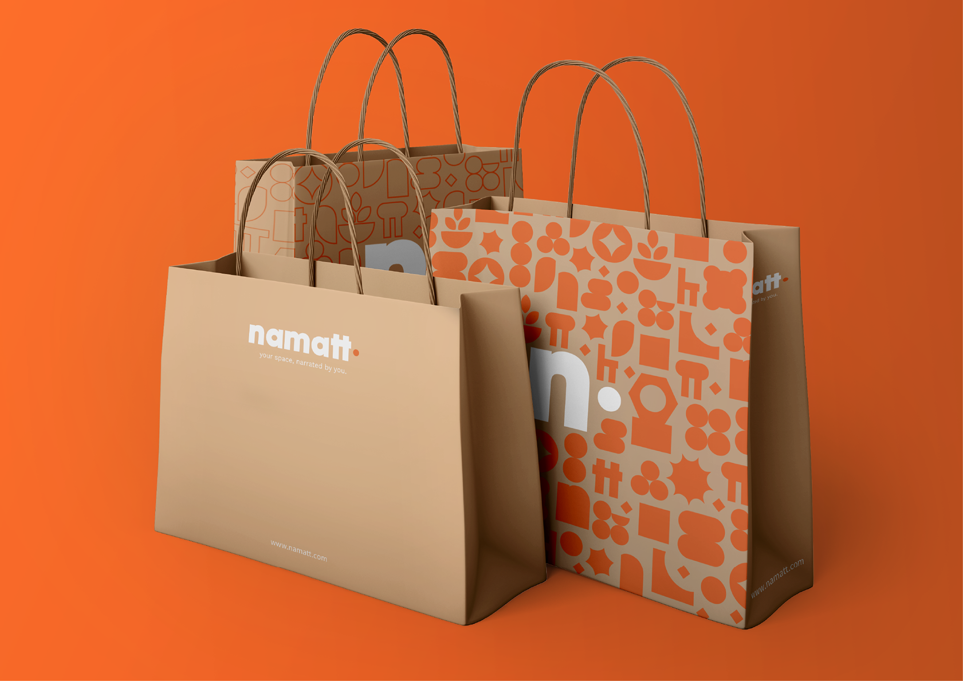 Kraft paper shopping bag mockups featuring NAMATT wordmarks and orange geometric patterns against an orange background.