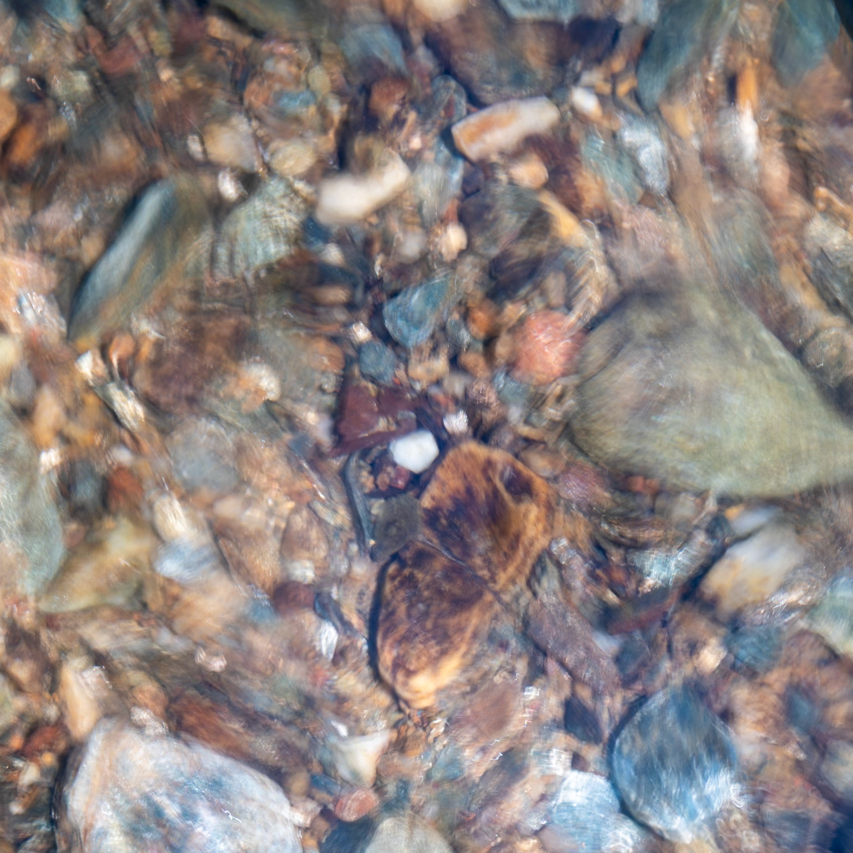 An attempt at a new type of abstract photography (new to me at least) using a slightly longer exposure of water flowing over rocks.