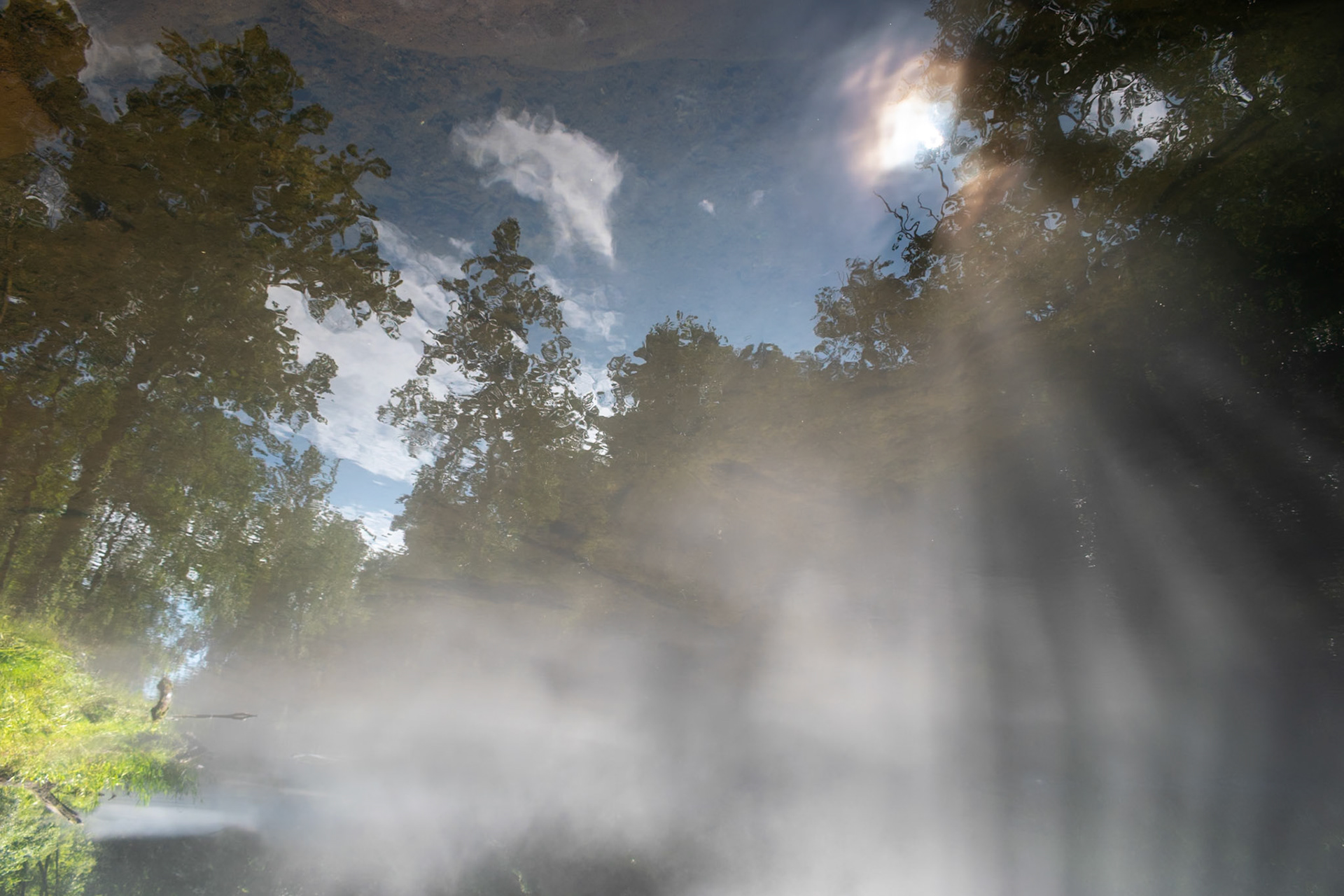 This is an unaltered photo -- other than that fact it is a photo of the water's surface turned upside down.  Fog obscures the water's surface.