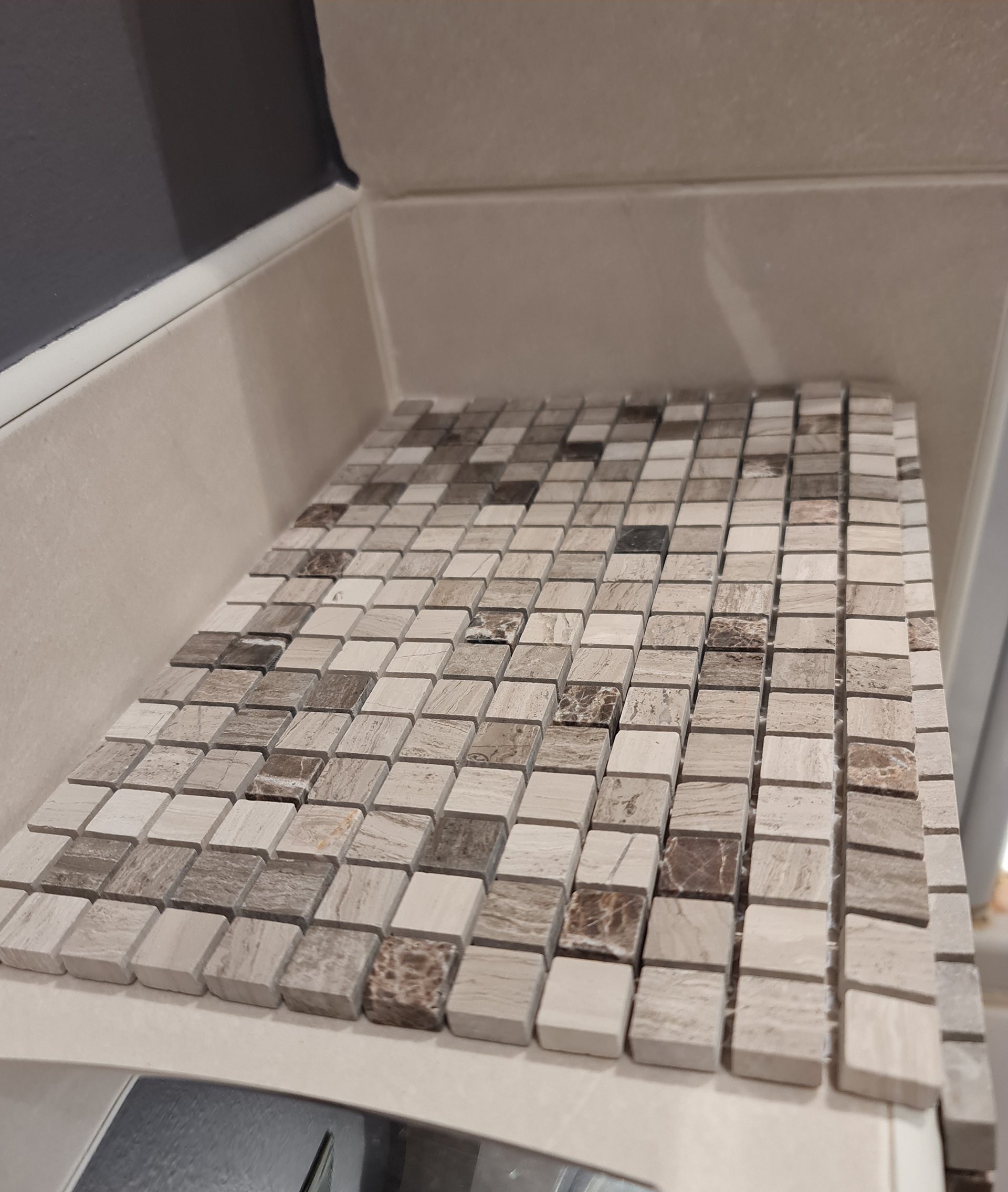 Acquiring tiles that look comparable without having to sacrifice design is challenging. The idea was to find a completely different size and shape in a colour that complements the existing tiles on the other areas as well as the wall colour and flooring.