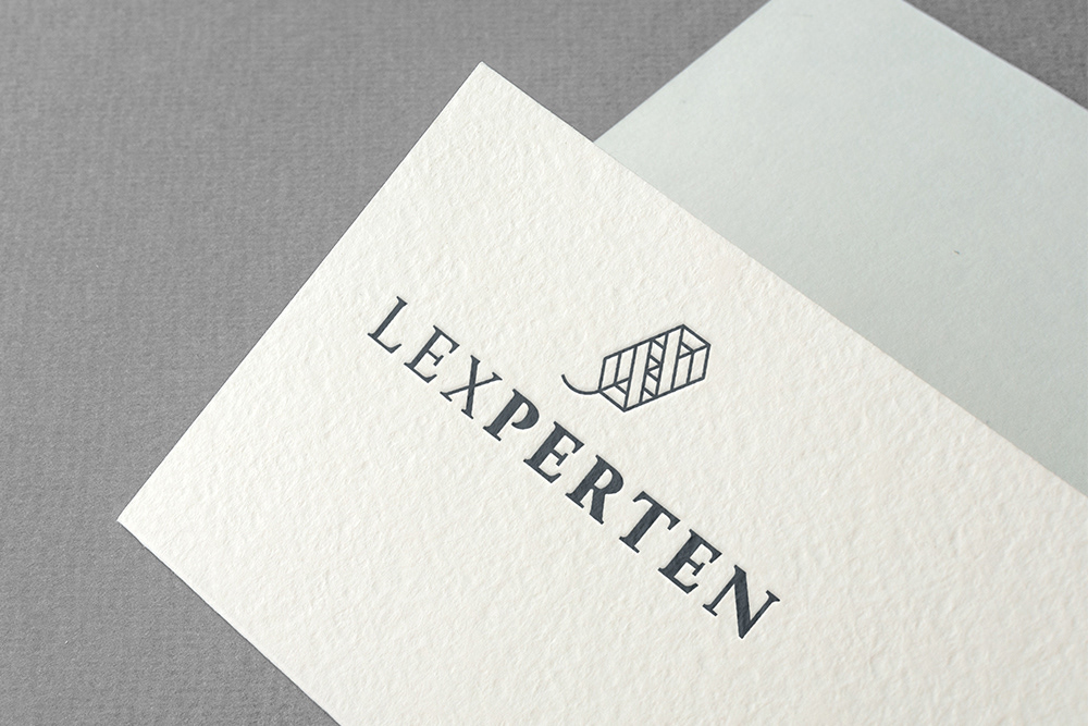 Printed logo detail of paper, design by Adrian Bauer.