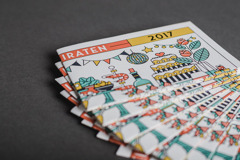 Close-up of printed illustrative wedding cards by Adrian Bauer
