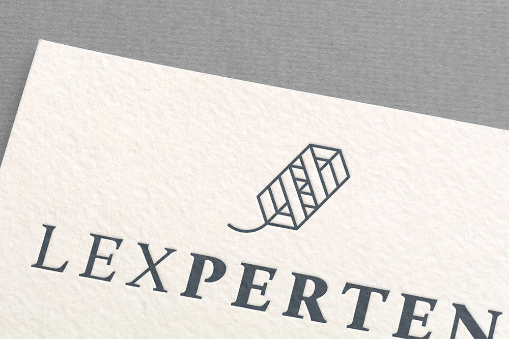 Printed Lexperten logo close-up on paper.