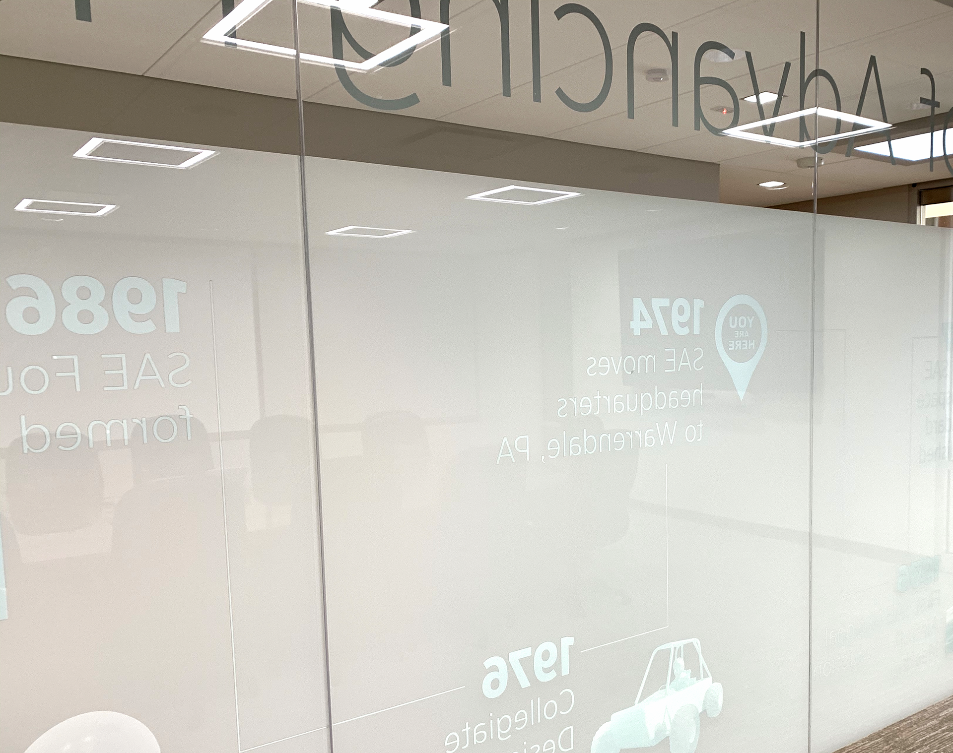 Inside conference room. Added white imprint to lessen mirror effect