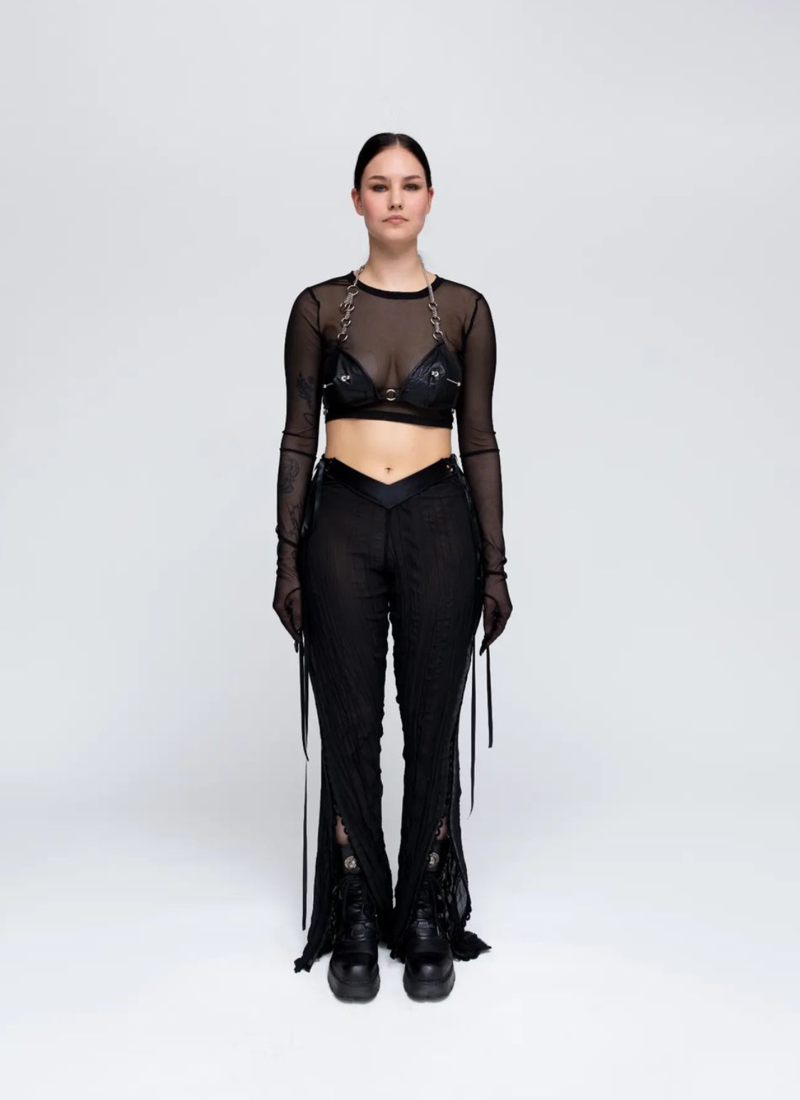 LOOK2. Mesh top, leather bra, lace-up pants.