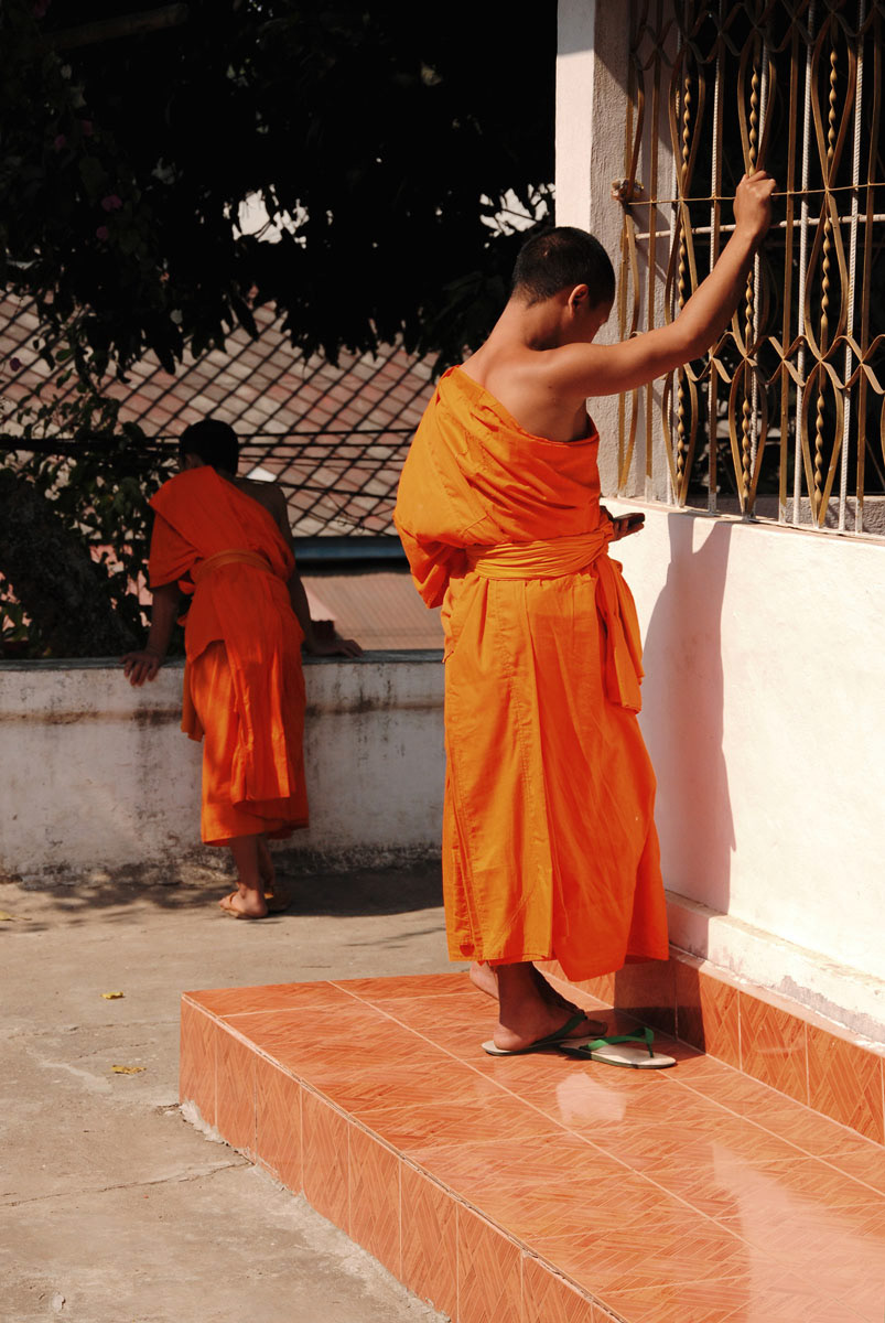 Monk checking his phone - Luang Prabang, 2010