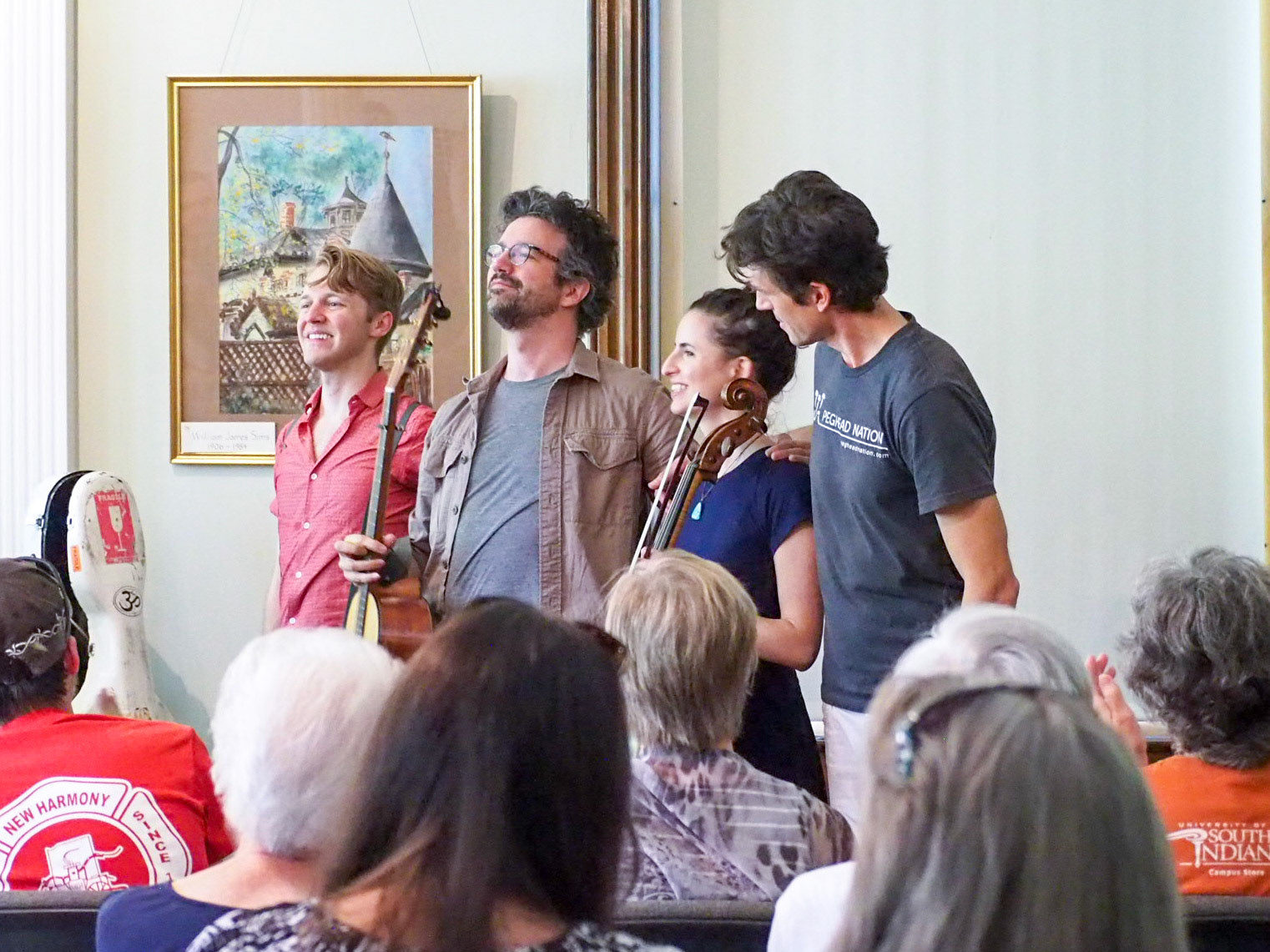 The artists take a bow after their afternoon performance at the Workingman's Institute.