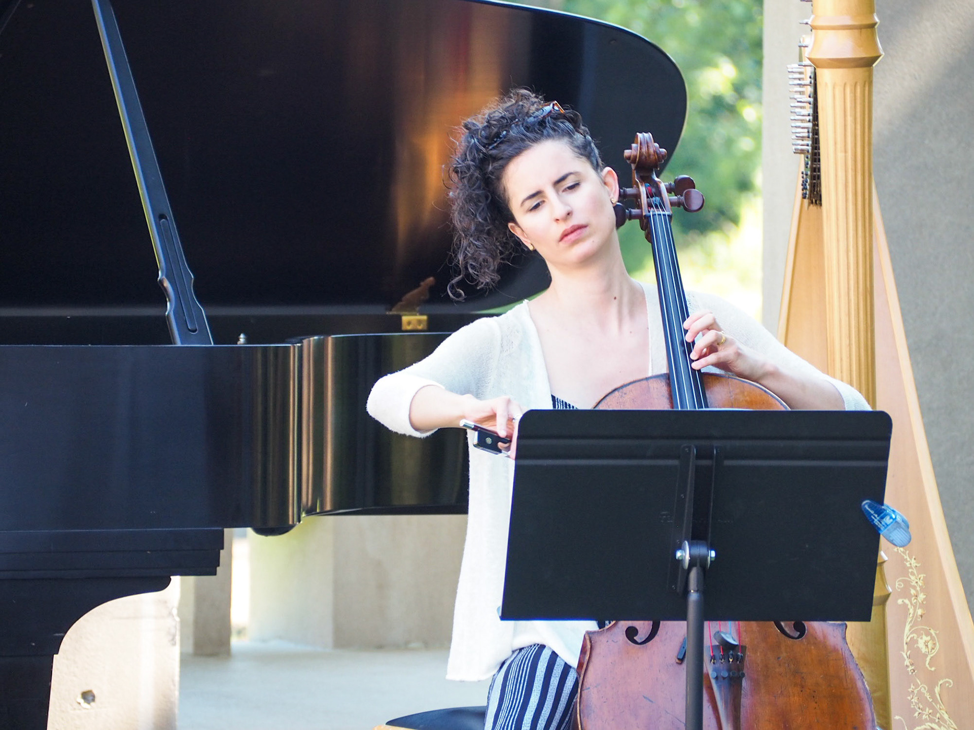 Ariel Friedman , composer and teacher, playing cello at the Roofless Church