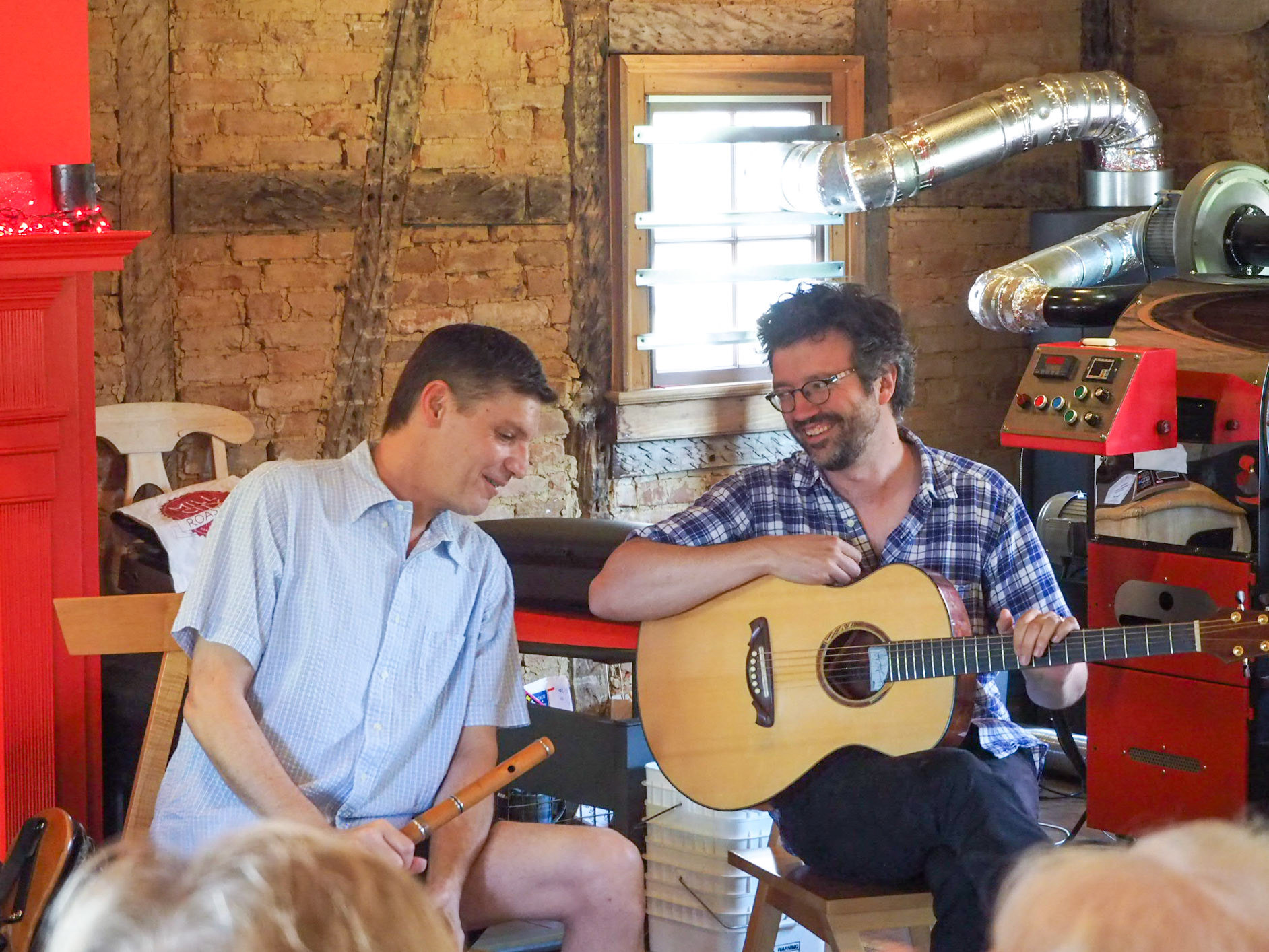 Christopher Layer, Festival founder, speaks to Yann Falquet during a performance.
