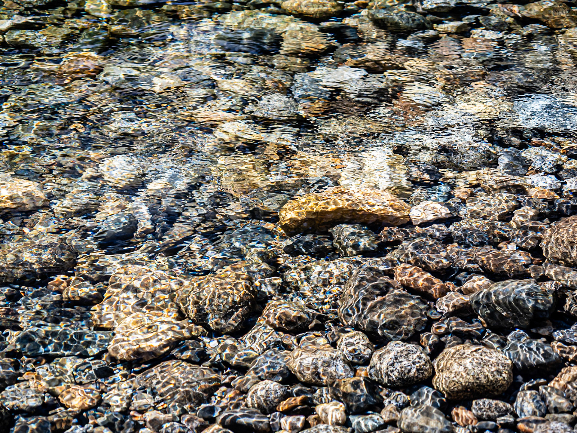 Ripples and Light on Smooth Stone: On Icicle Creek, tributary to the Wenatchee River near Leavenworth WA.