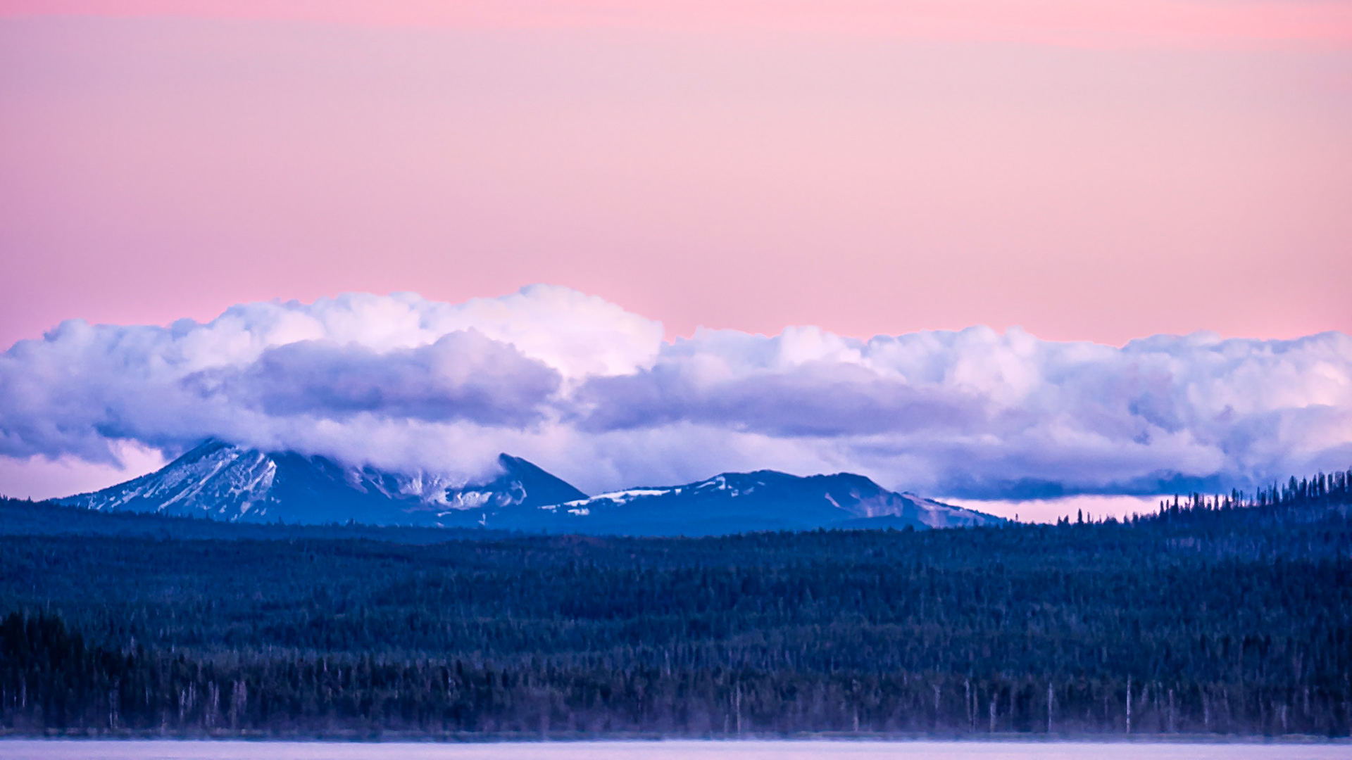 Mt. Mazama After Sunset: Mt. Mazama wears a cloak of clouds following a refreshing day of wind, rain and snow that was greatly needed to drive away forest fire smoke.  A slight mist rises from Diamond Lake in the foreground