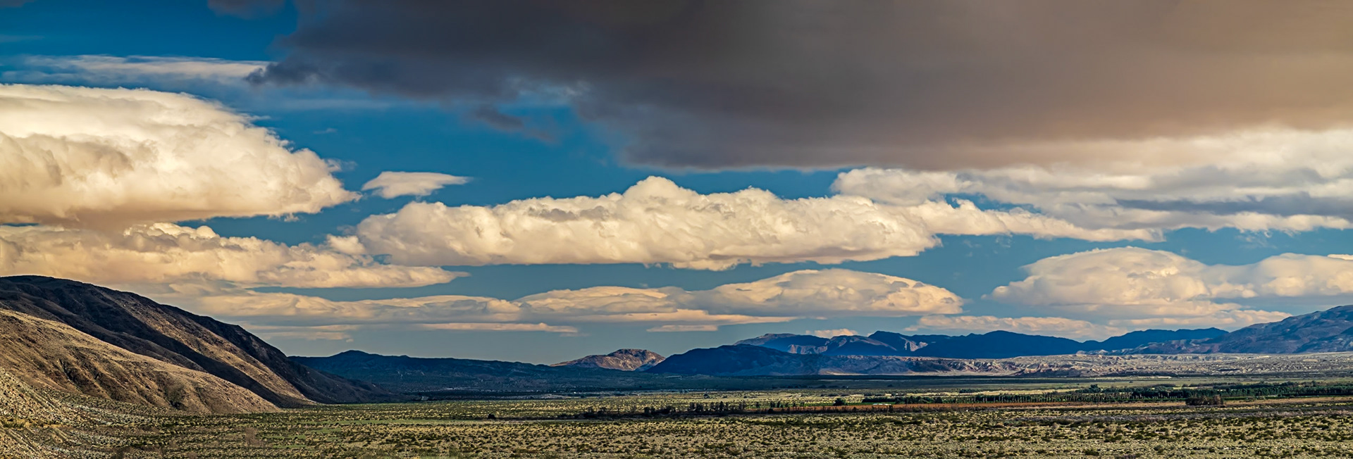 Desert Clouds Panorama: These puffy stratocumulus clouds look ominous but usually signify dry weather or light rain.
