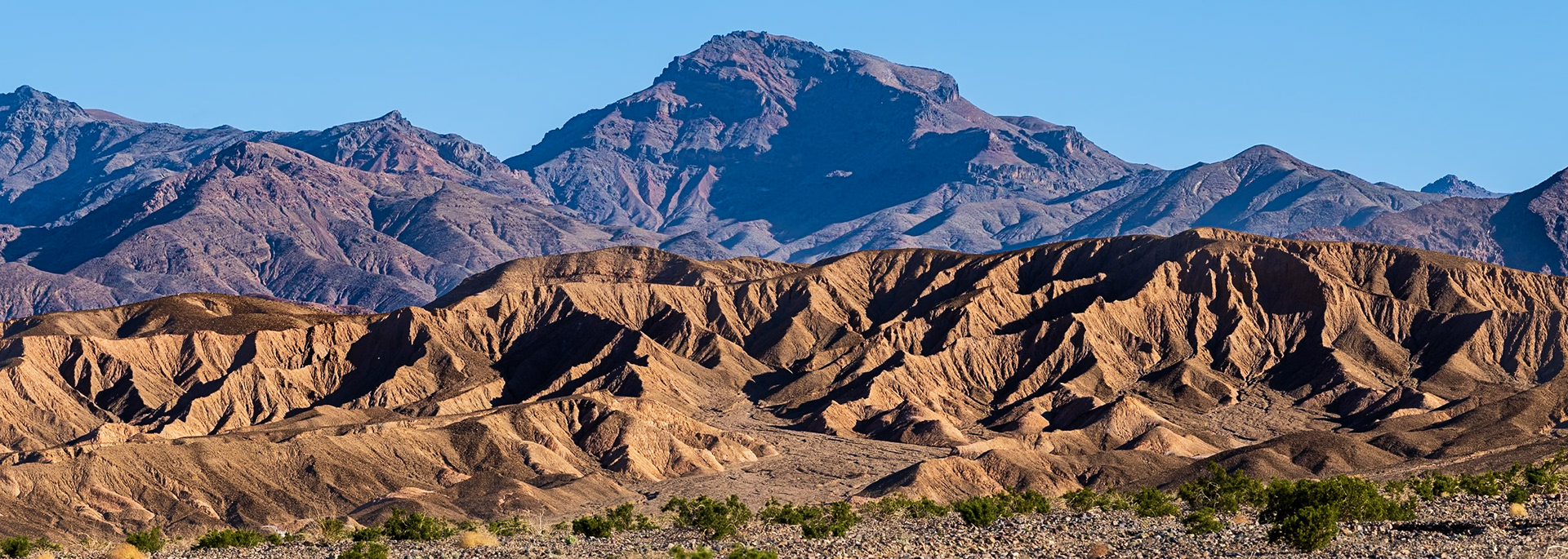 Grapevine Mountains: In early morning light, the Grapevine Mountians rise from Death Valley  with steep ridges and deeply shadowed ravines.