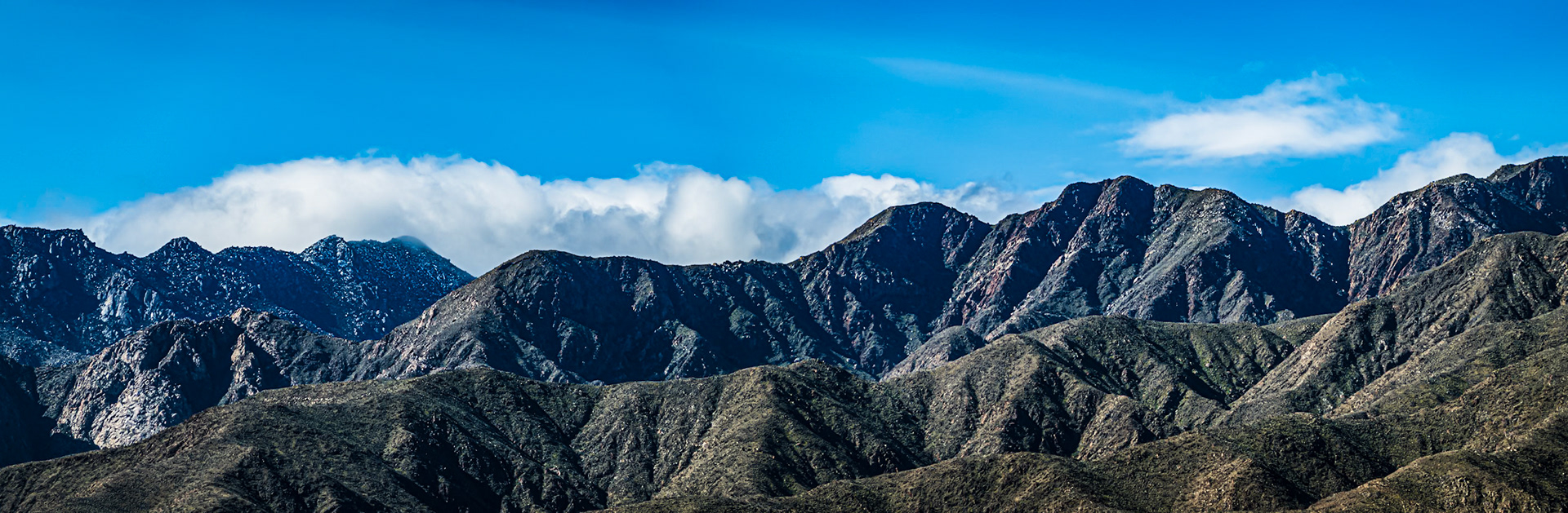 San Ysidro Panorama: Clouds gathering to push over the San Ysidro Mountains onto the Anza-Borrego Dersert.