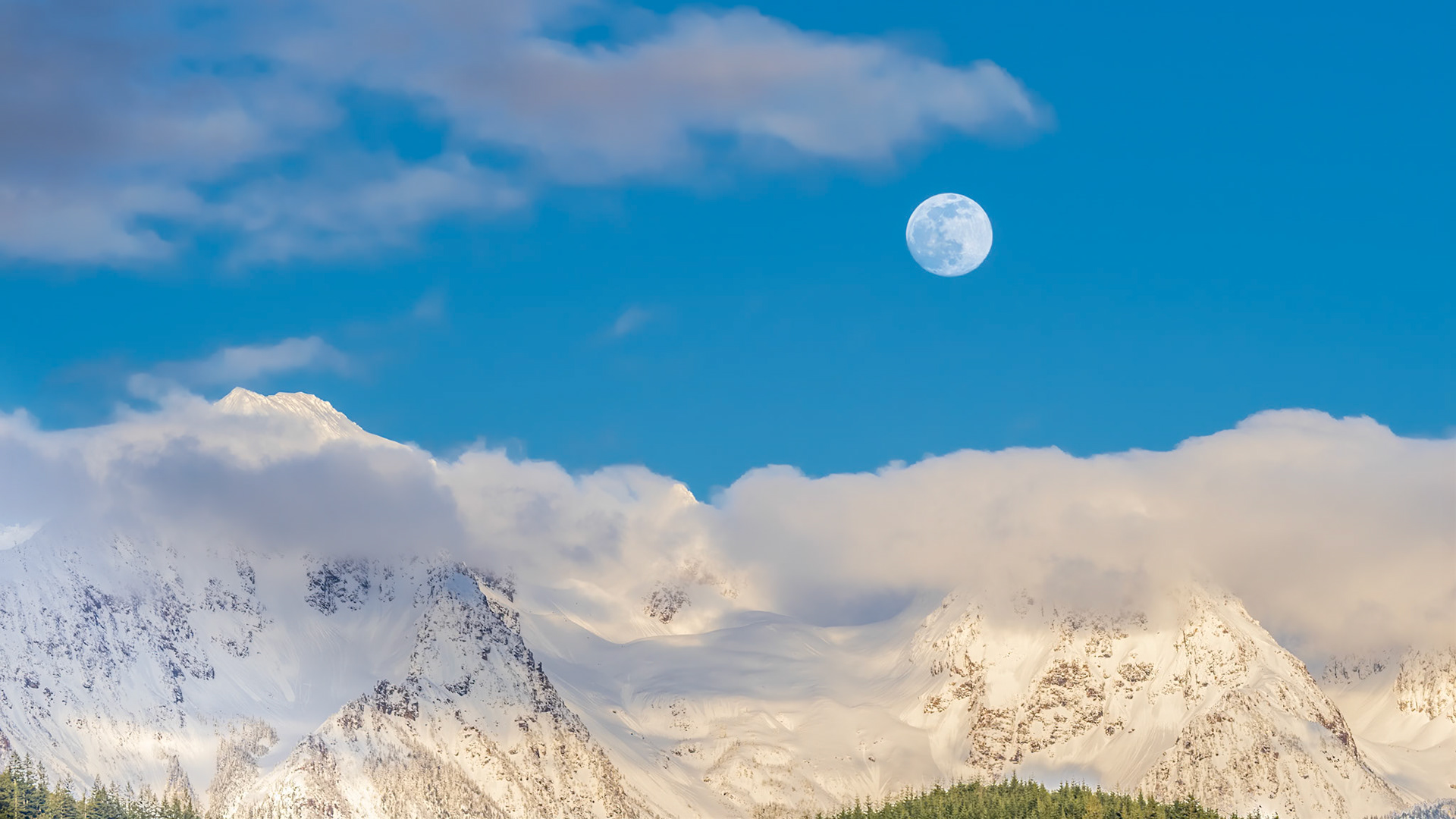 Cascade Moon Blue Hour: The moon rising in the blue hour above Twin Peaks near Mt. Baker in the Washington Cascades.