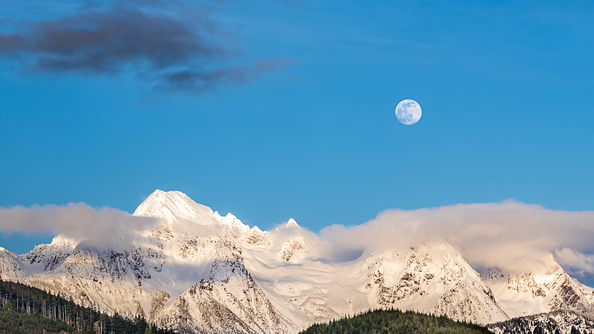 Cascade Moonrise Panorama 3: The clouds parted on an overcast day to reveal the moon rising above Twin Peaks near Mt. Baker in the Washington Cascades