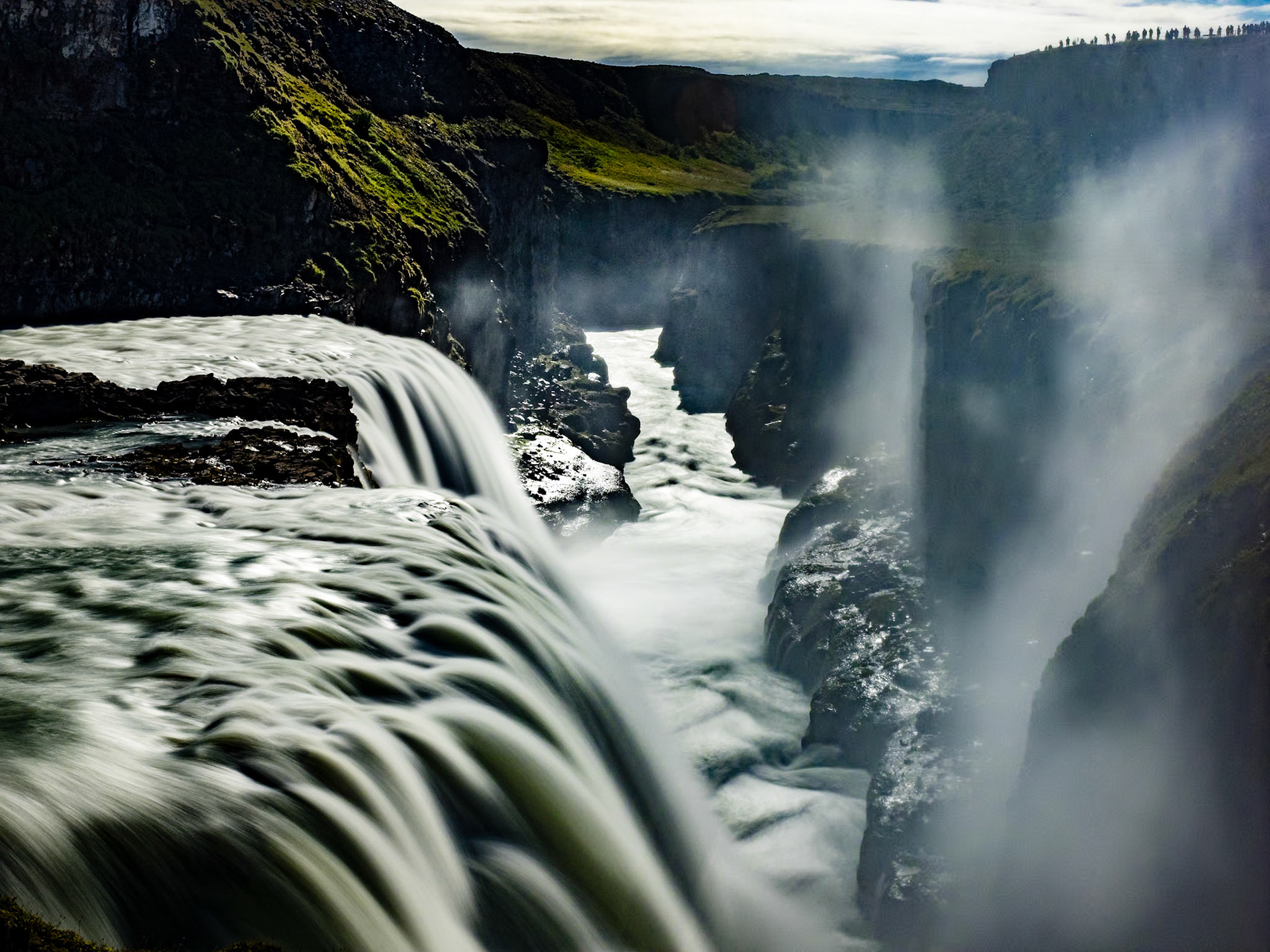 Into the Chasm at Gullfoss, Iceland: The lower of Gullfoss' two  falls cascades into a steep ravine at the head of the Golden Circle Loop near Reykjavik Iceland.