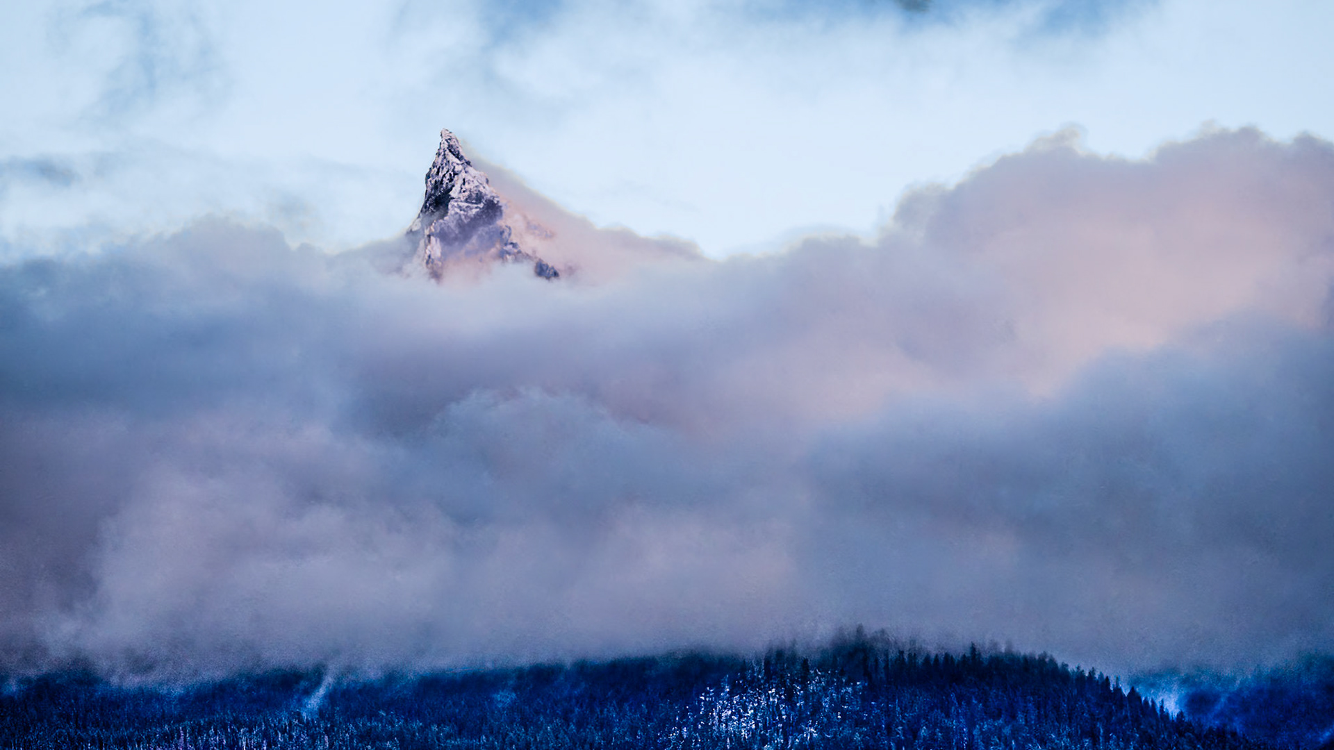 Mt. Thielsen - A Cascade Alp: Mt. Thielsen near Diamnond Lake Oregon peeks through cloud cover showing off its fresh coat of fall snow.