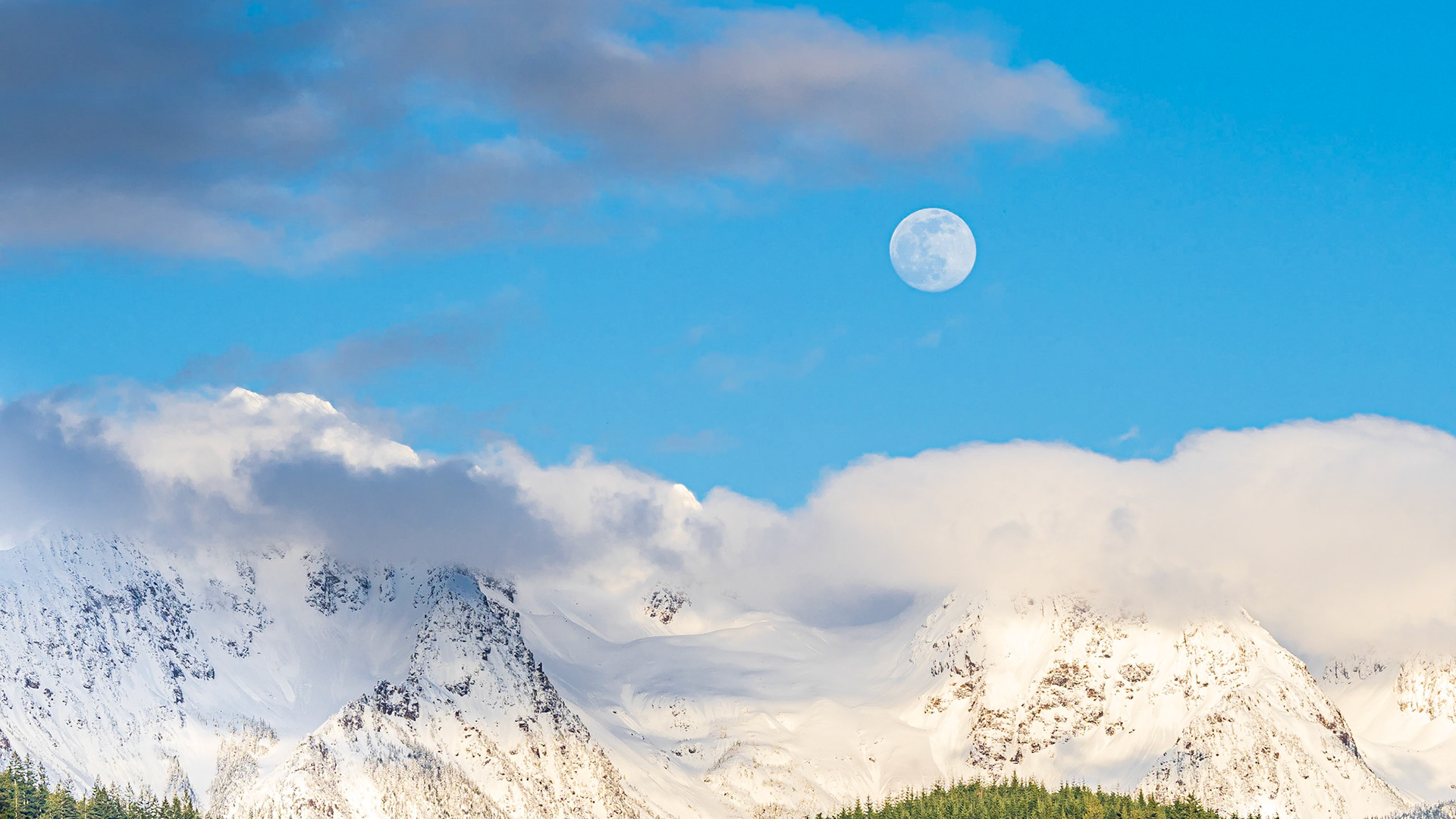 Cascade Moonrise Panorama: The clouds parted on an overcast day to reveal the moon rising above Twin Peaks near Mt. Baker in the Washington Cascades